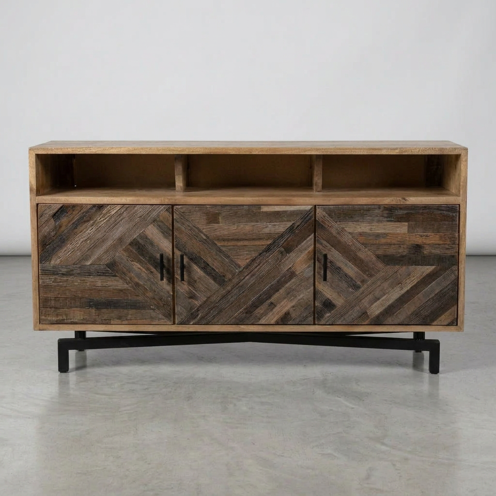 A rustic wooden media console with three doors featuring a herringbone wood pattern, open shelving on top, and a black metal base, shown against a neutral gray studio background.