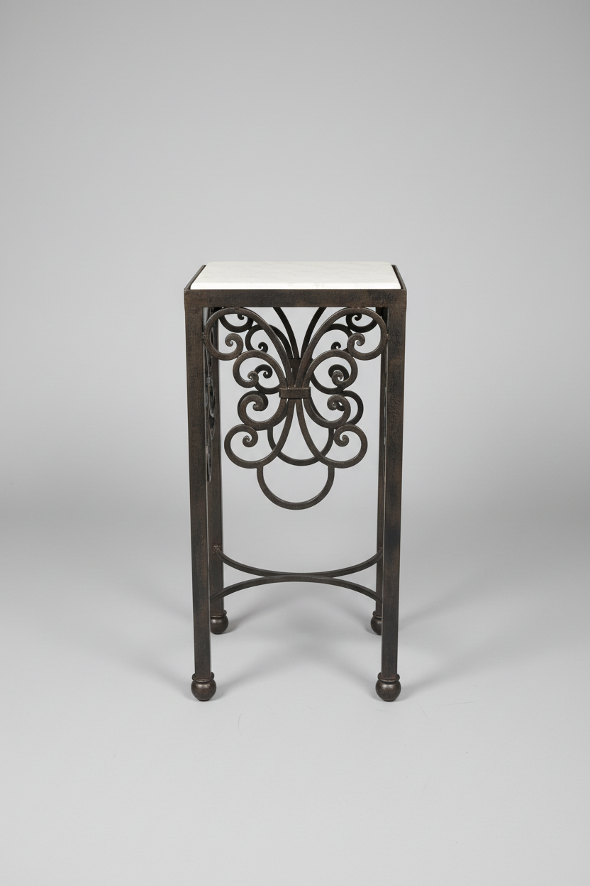 Decorative metal side table with intricate design on a gray background