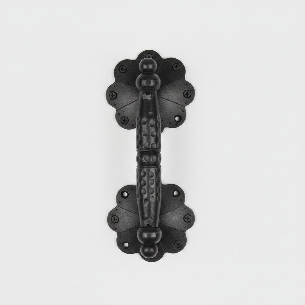 Black decorative door handle on a white background