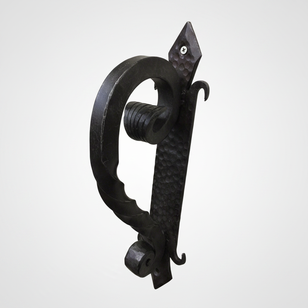 Decorative black metal handle on a white background
