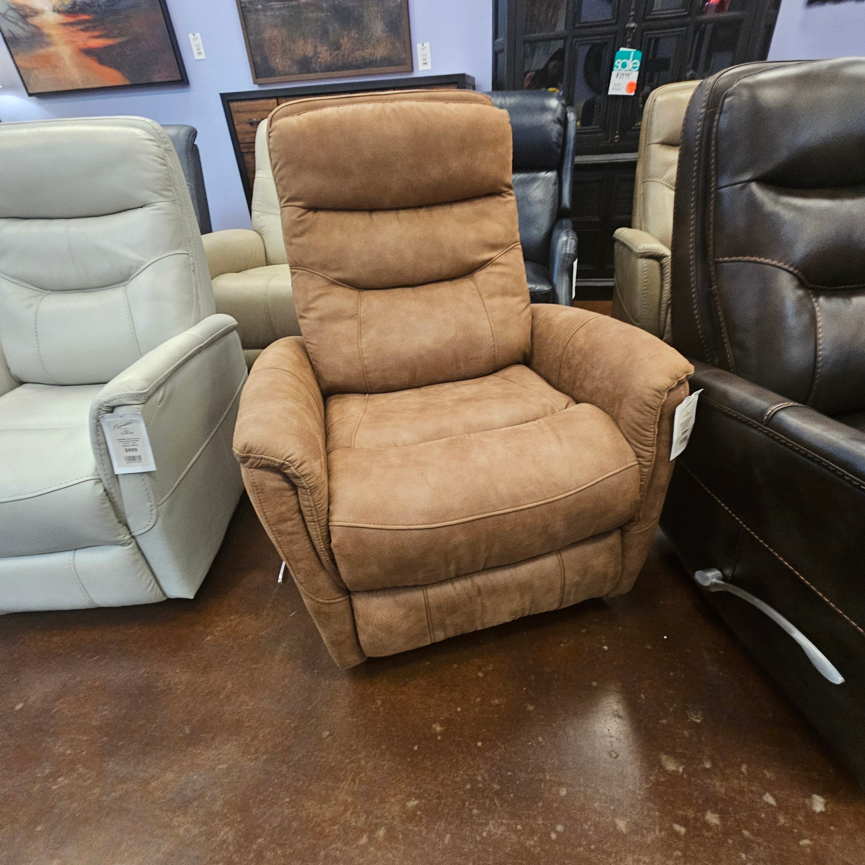 Brown recliner chair in a furniture store with other chairs.