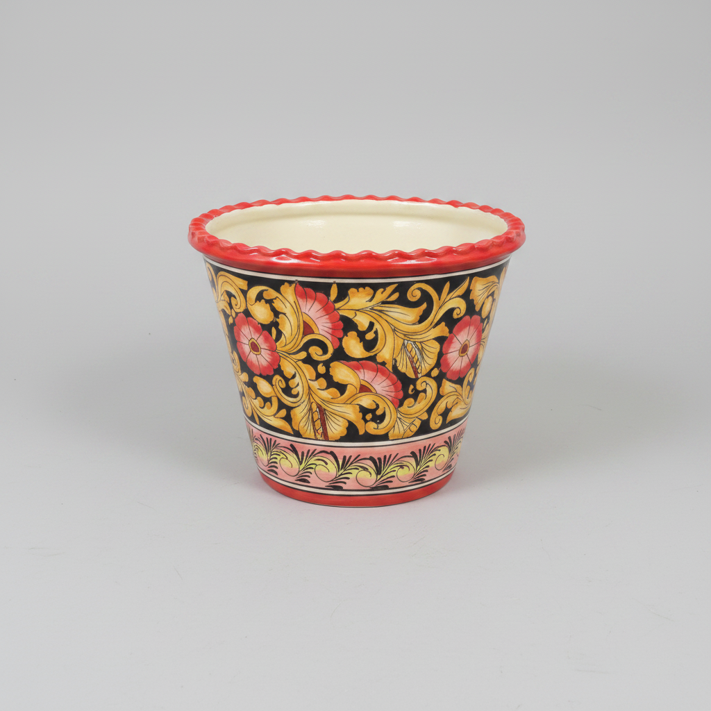 Decorative ceramic pot with floral patterns on a gray background