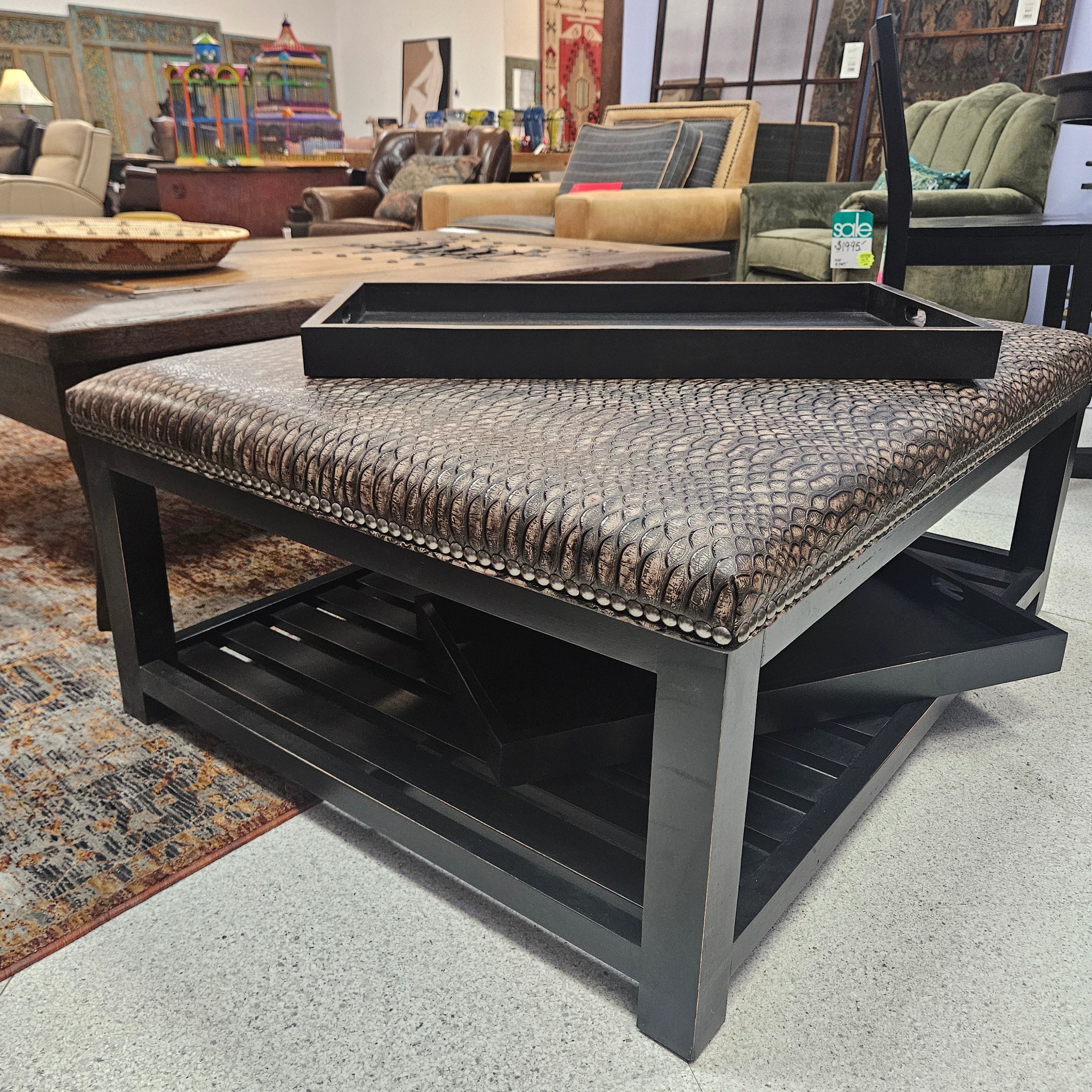 Decorative woven bench with black frame on a textured floor