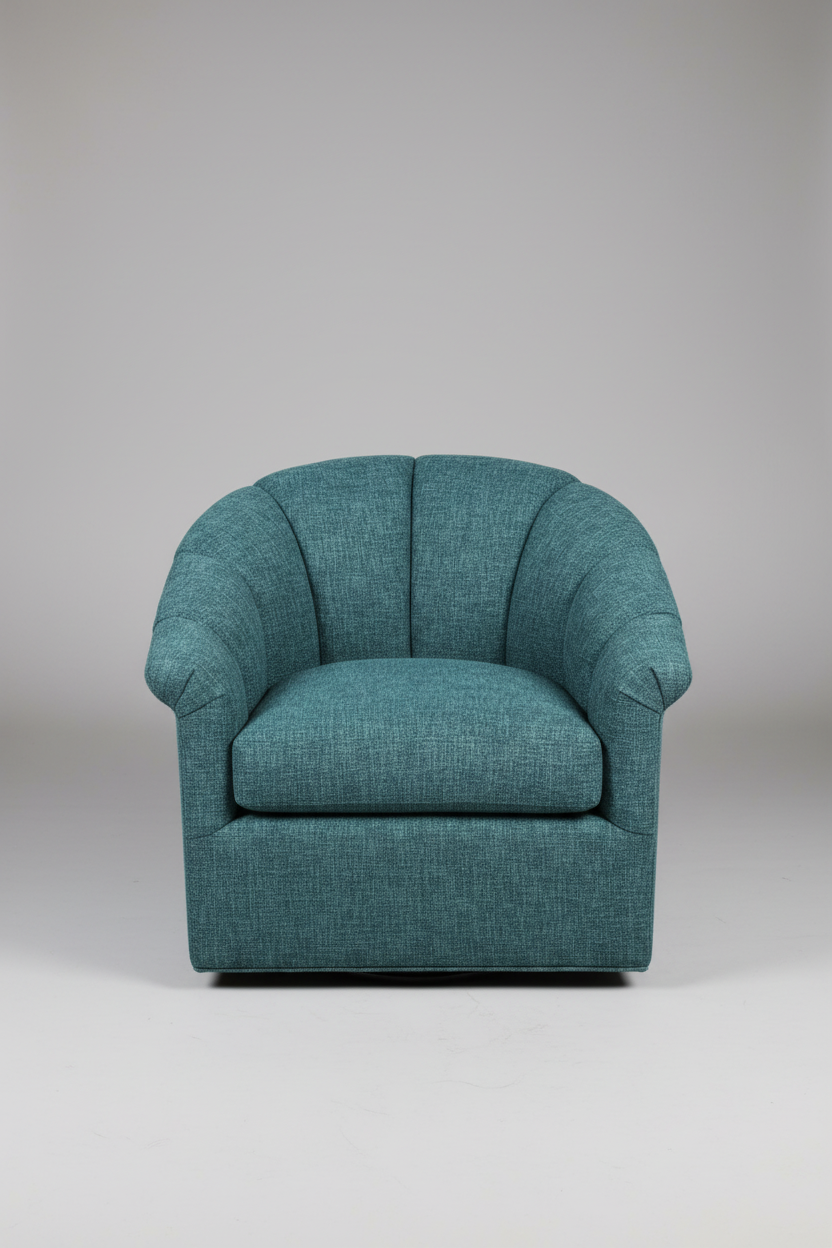 Teal armchair on a plain background