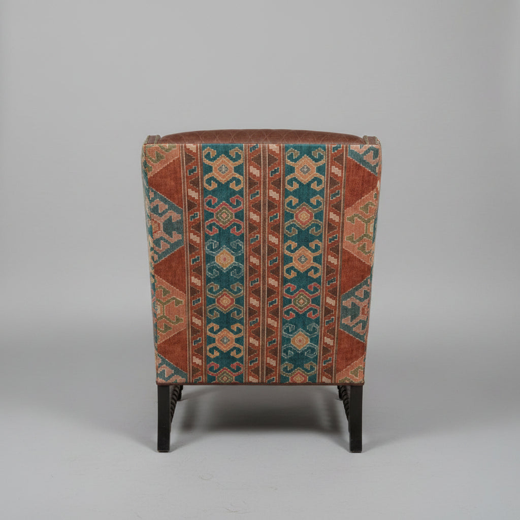 Decorative chair with patterned fabric on a gray background