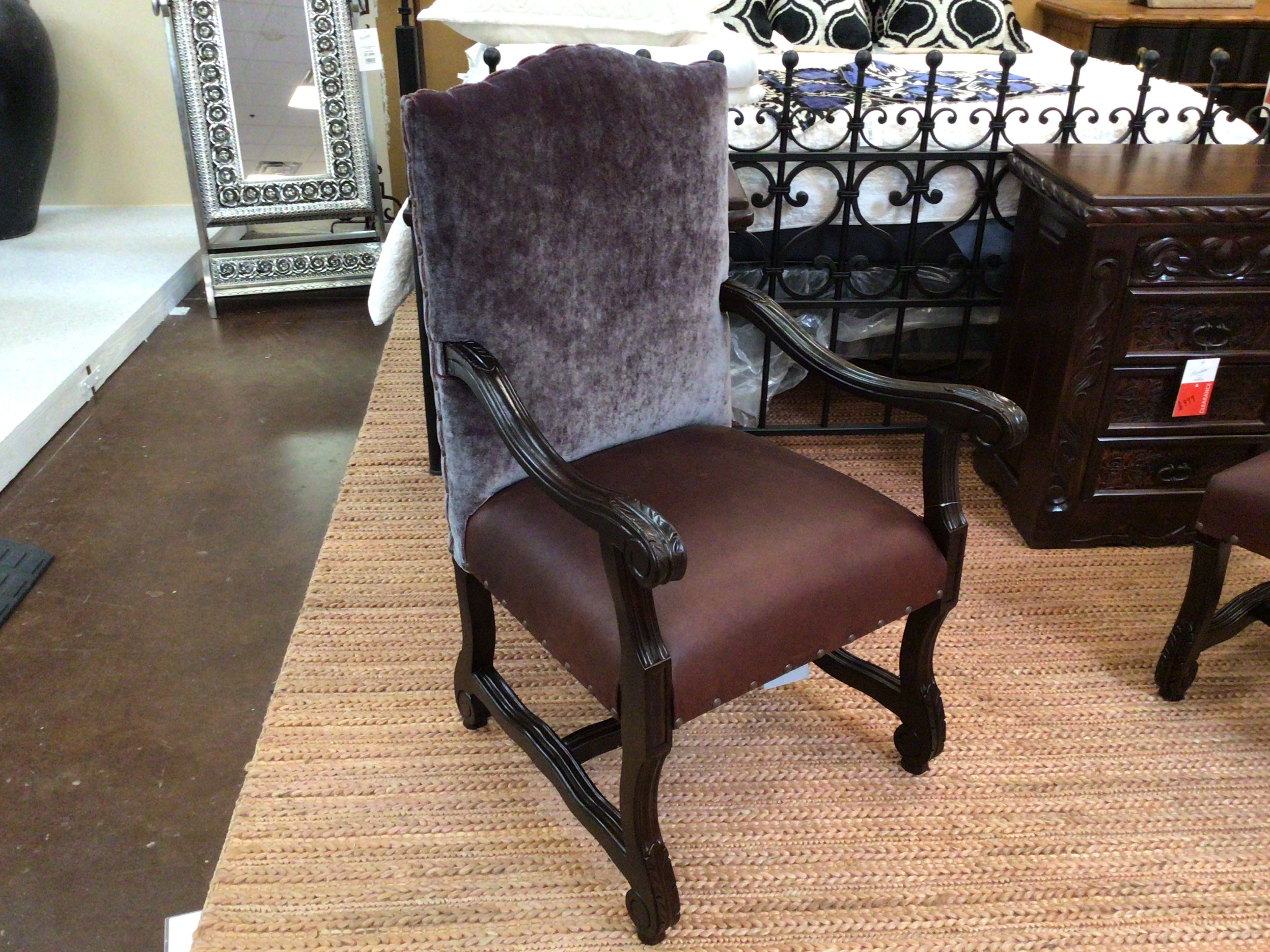 Chair with purple backrest and brown seat in a store setting
