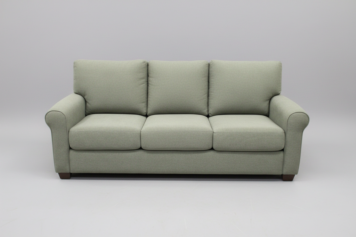 Green sofa with a price tag in a store setting