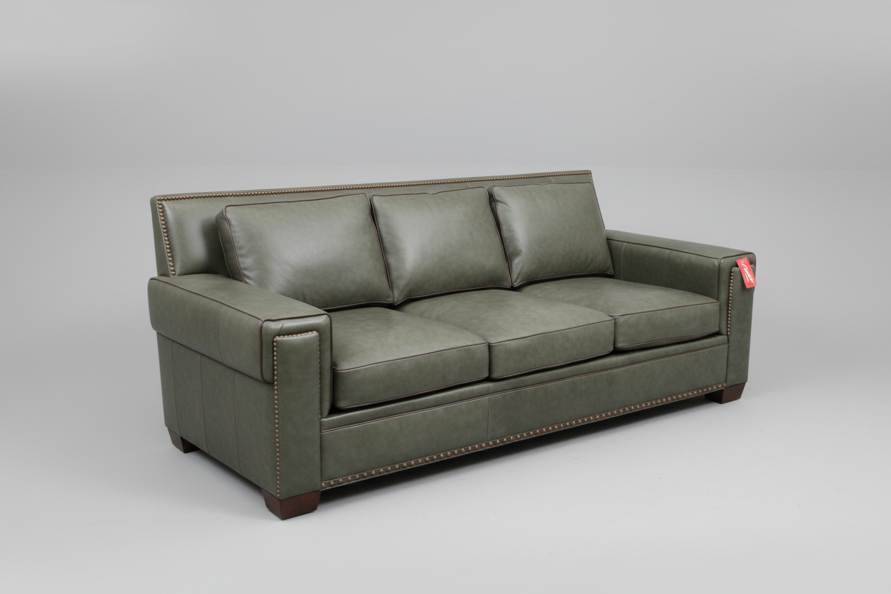 Green leather sofa on a gray background
