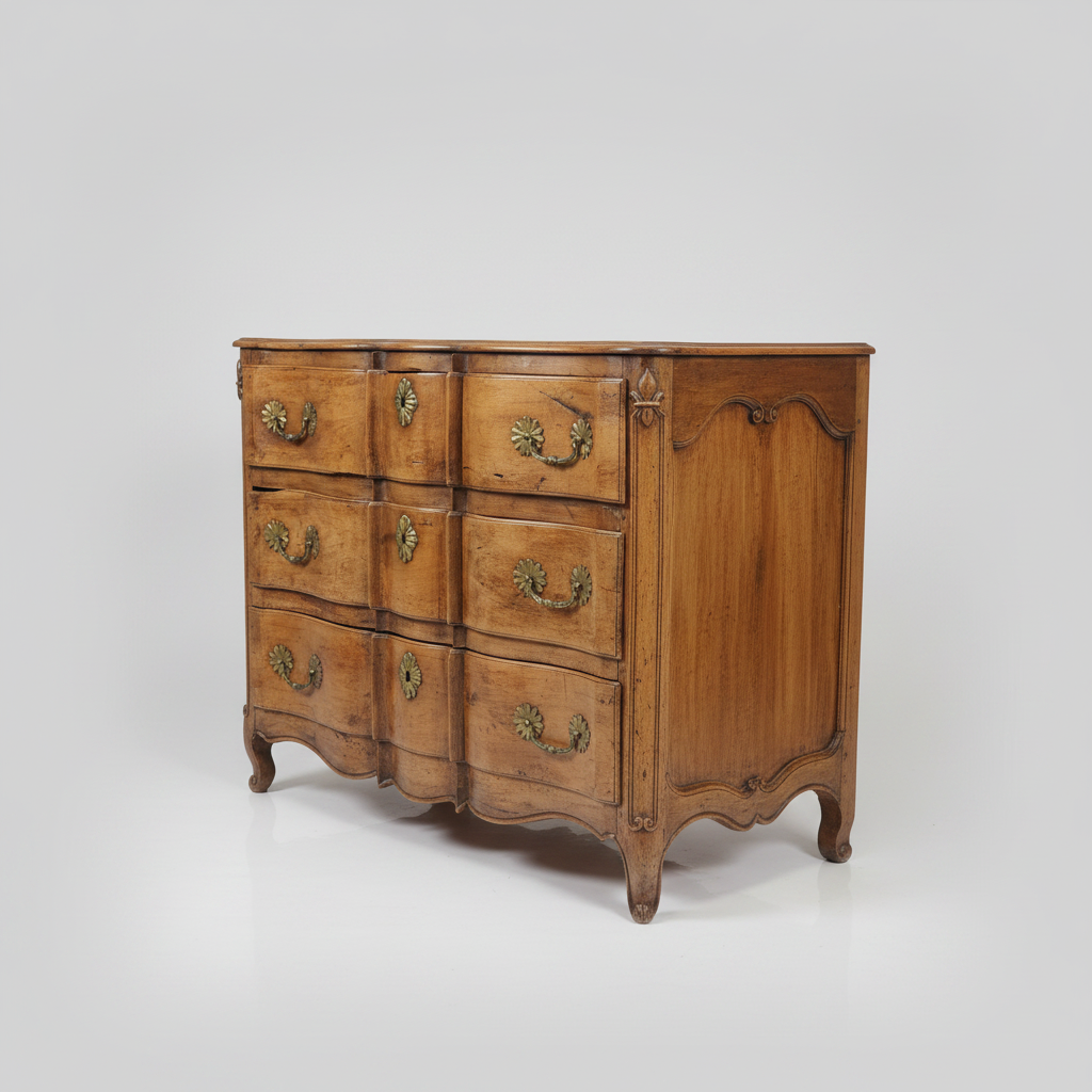 French antique wooden dresser with curved design and brass handles on a white background