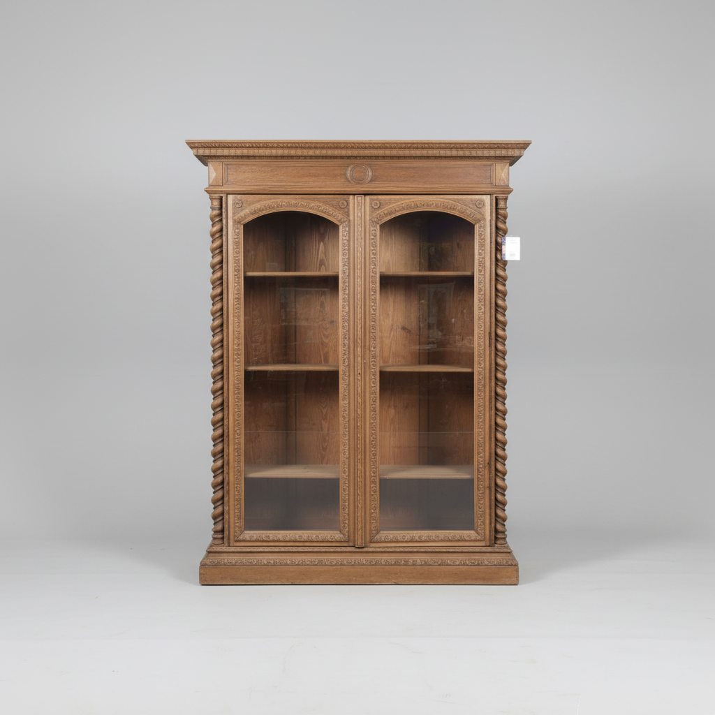 Wooden bookshelf with glass doors on a gray background