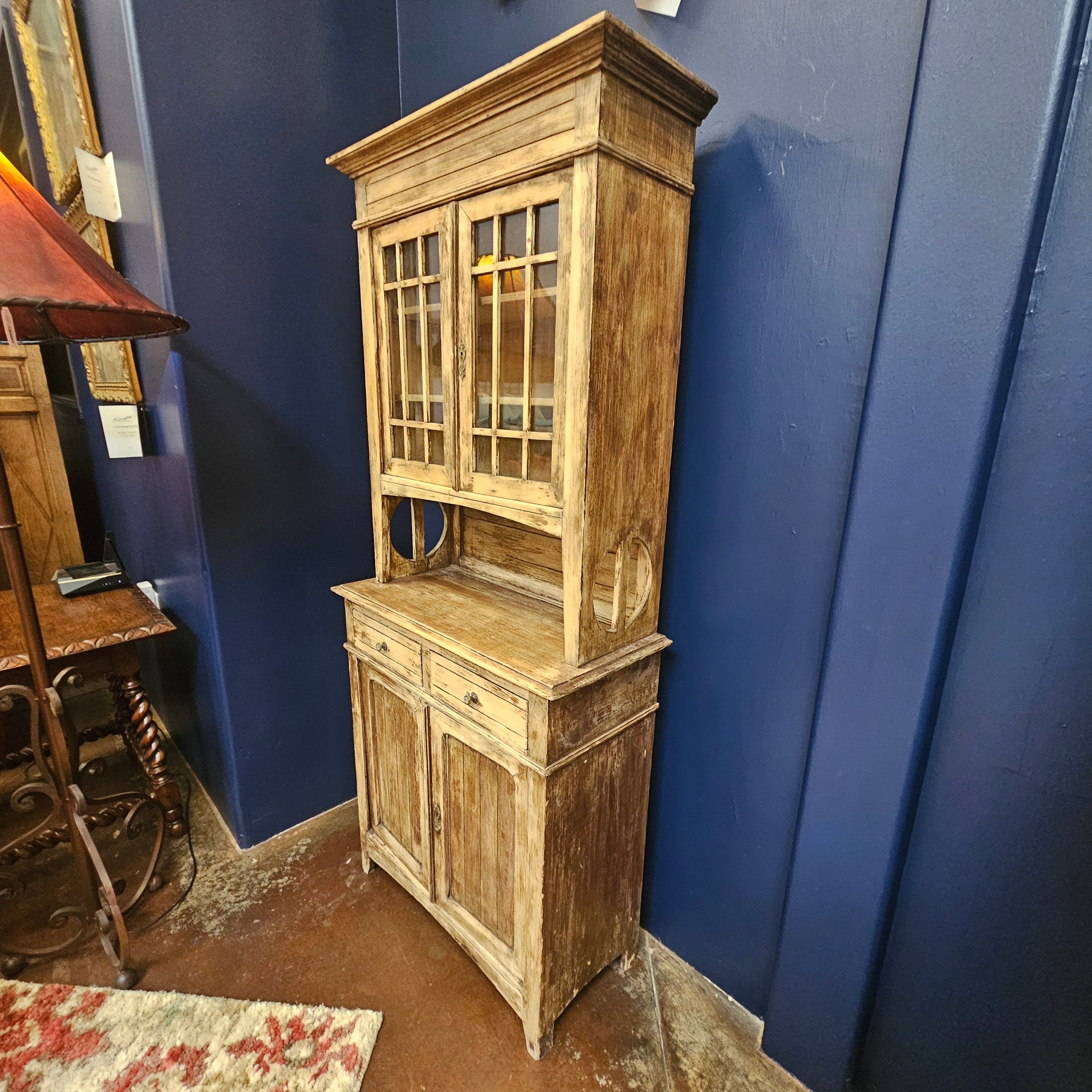 Wooden cabinet against a blue wall