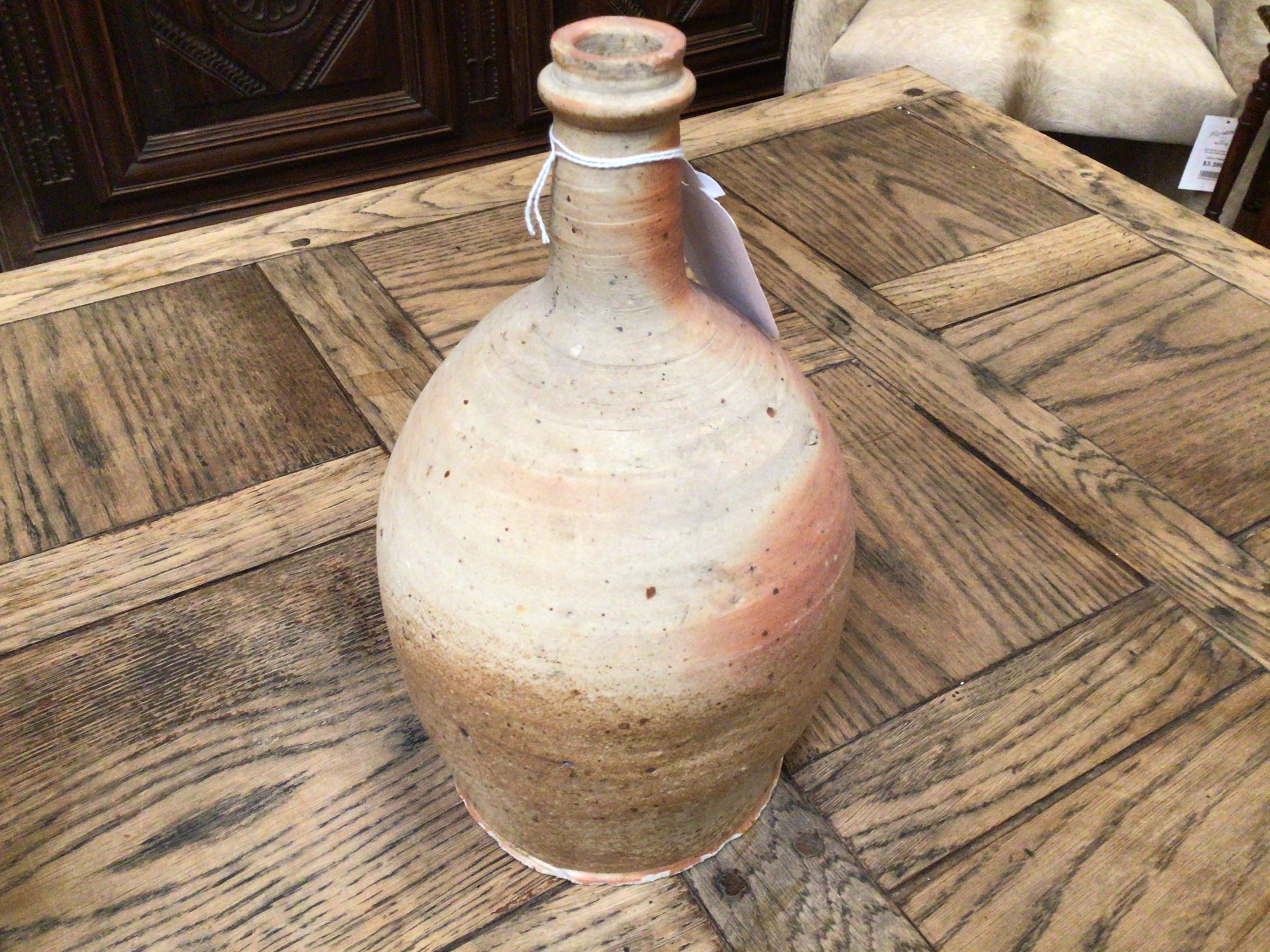 Vintage ceramic bottle on a wooden surface