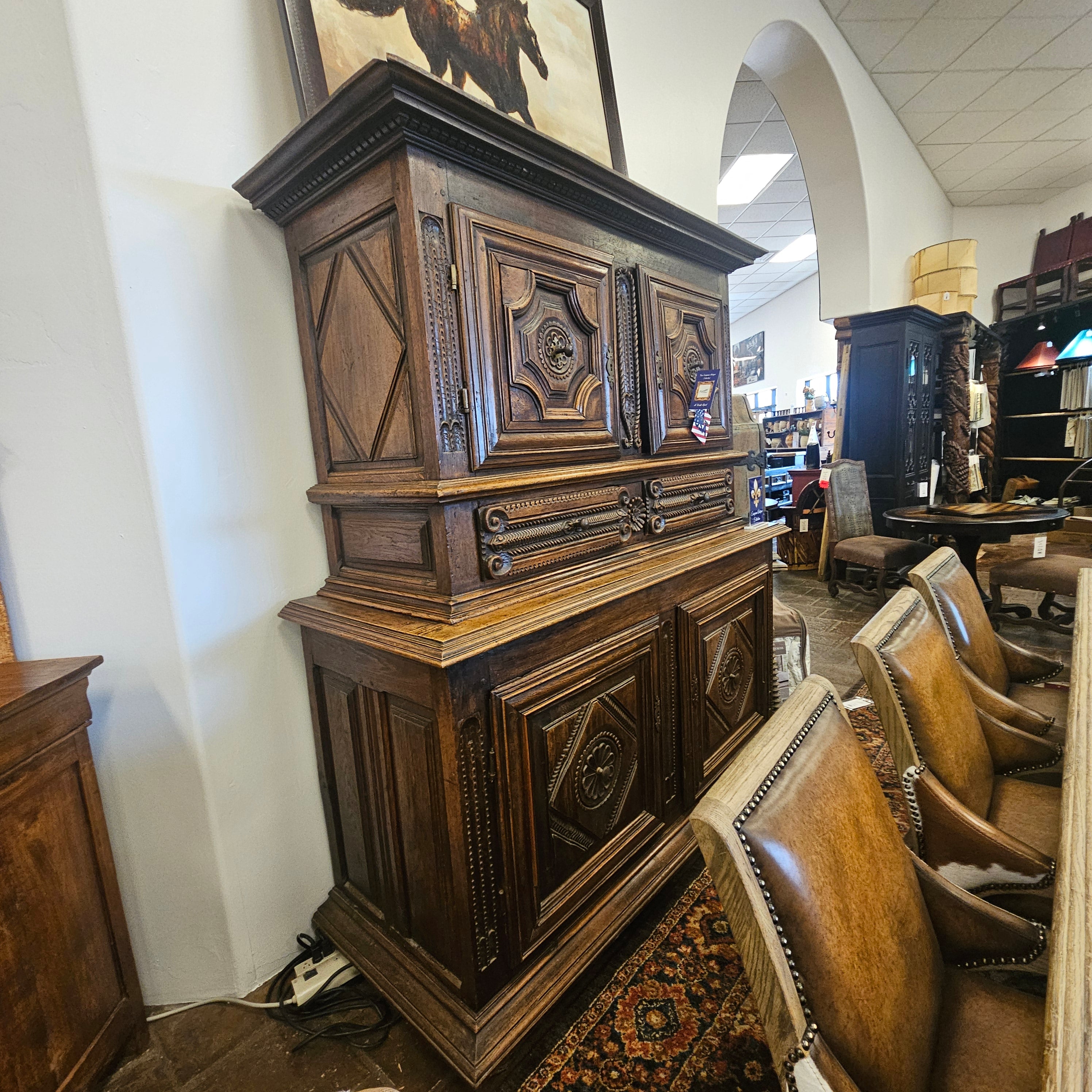 Wooden furniture with intricate carvings on a white surface