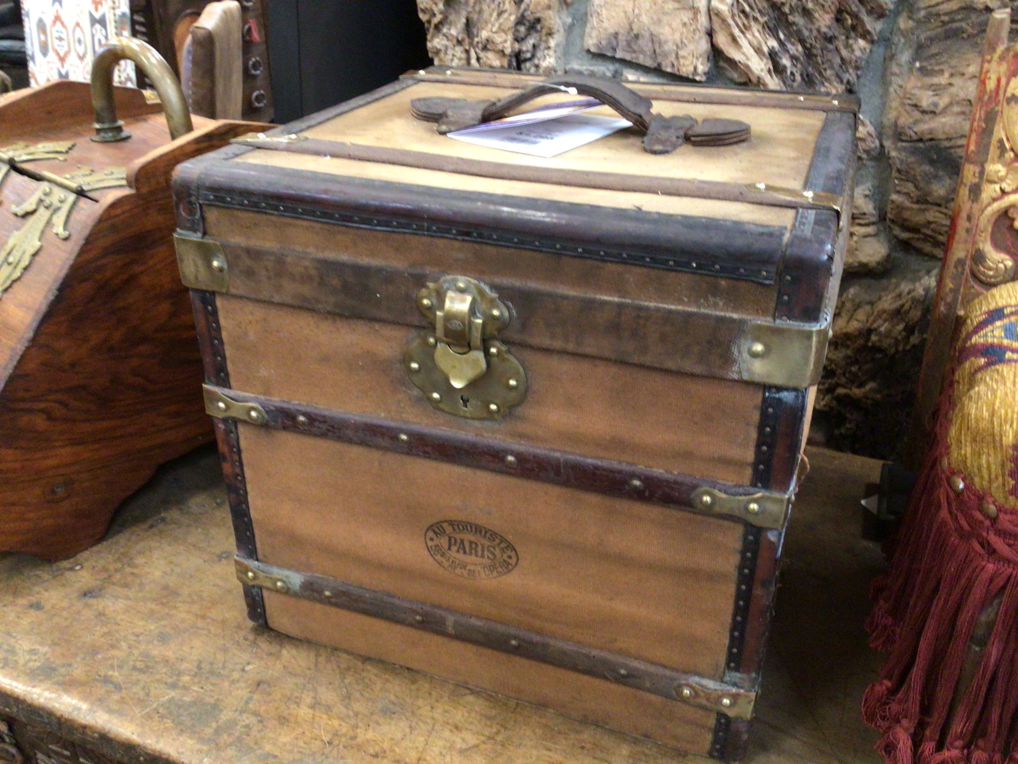 Vintage wooden trunk with metal accents on a rustic surface