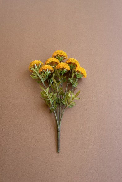 Bouquet of yellow flowers on a brown background