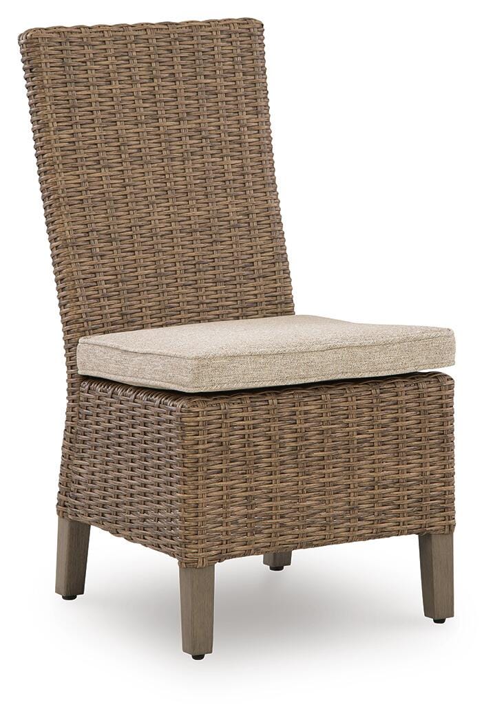 Wicker chair with a cushion on a white background