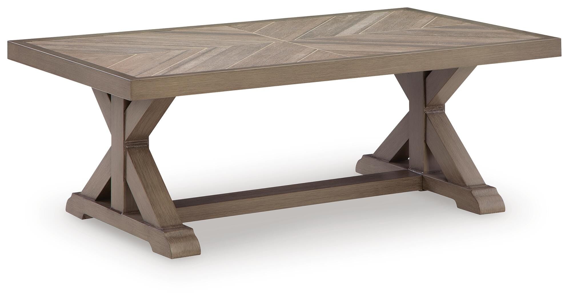 Wooden dining table with chevron pattern on a white background