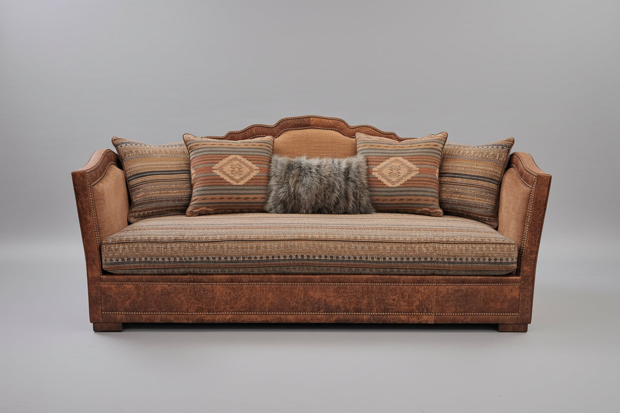 Brown sofa with patterned cushions on a gray background