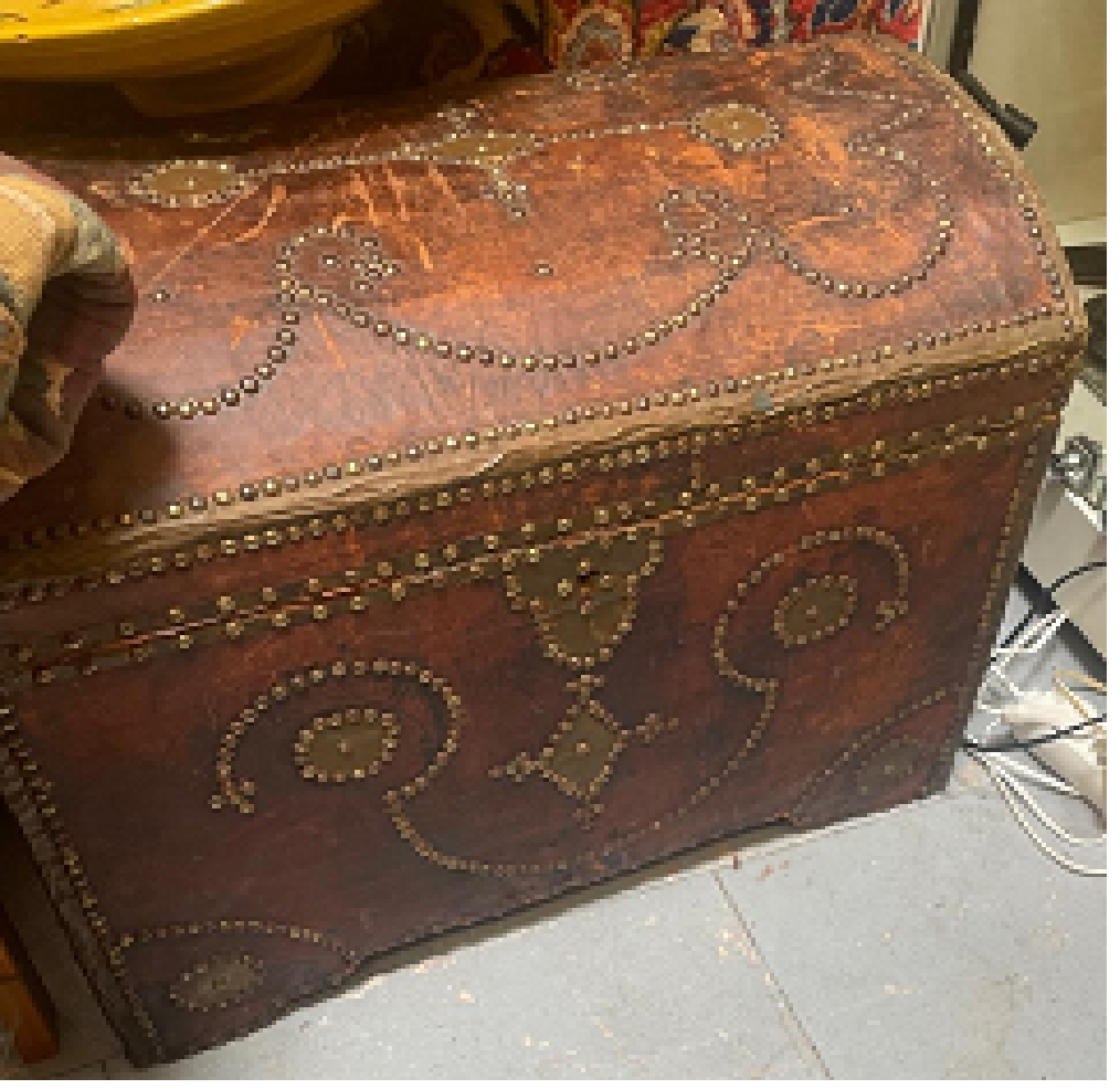Moroccan studded leather trunk with brass studs in scrolling arabesque patterns