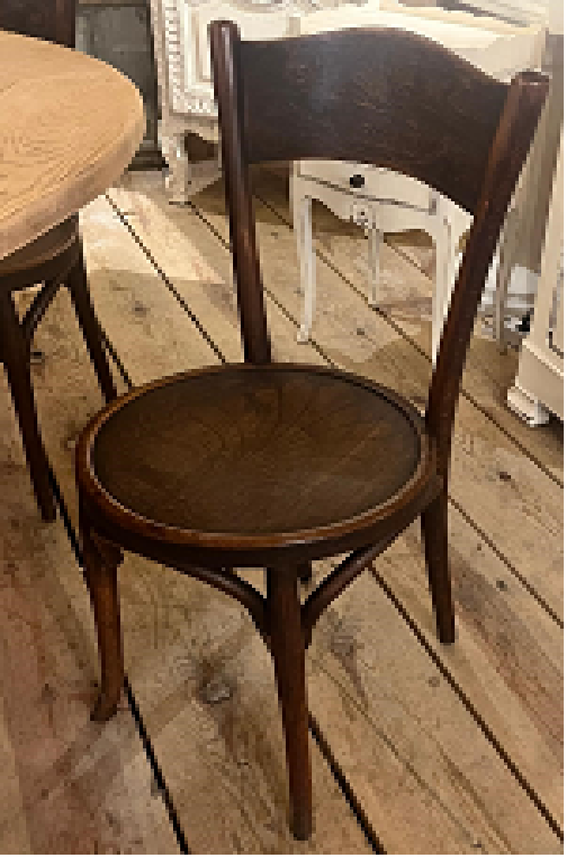 Twelve bentwood bistro chairs with circular seats and curved back rails in dark beech