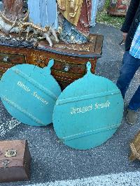 Pair of round bakery boards in soft teal paint with hand-lettered white script