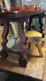 Spanish console table with a shaped top over turned legs joined by iron stretchers