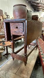 French Jura folding table in dark oak with drop leaves and turned legs