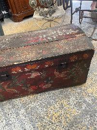 Normandy painted wedding trunk with a domed lid in reds and creams bound with iron straps