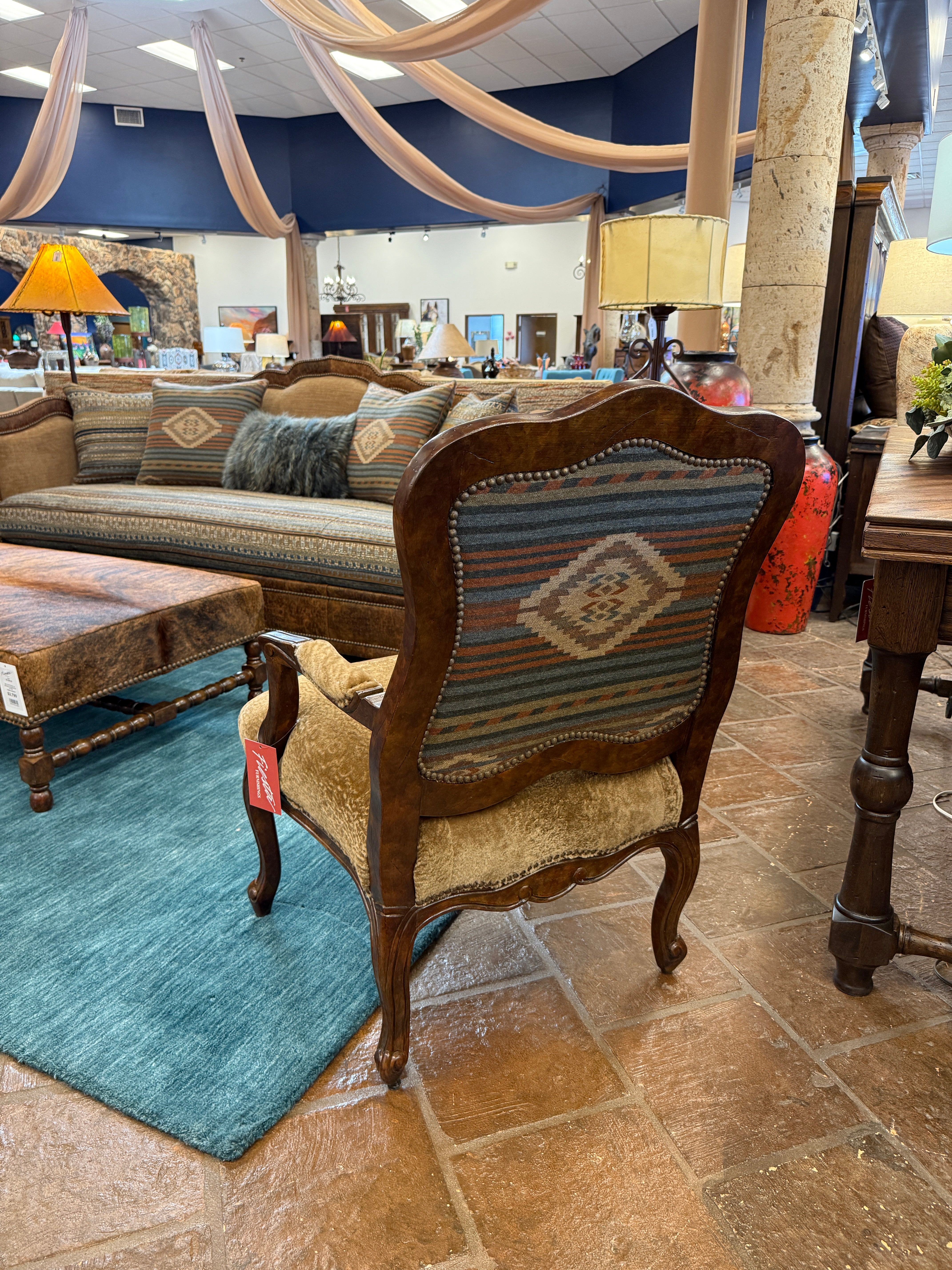 Wooden chair with patterned backrest in a furniture store setting