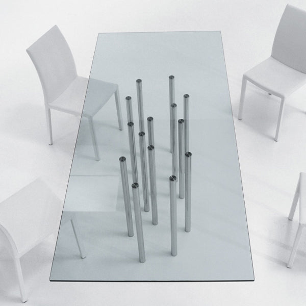 Clear glass table with metal legs on a white background