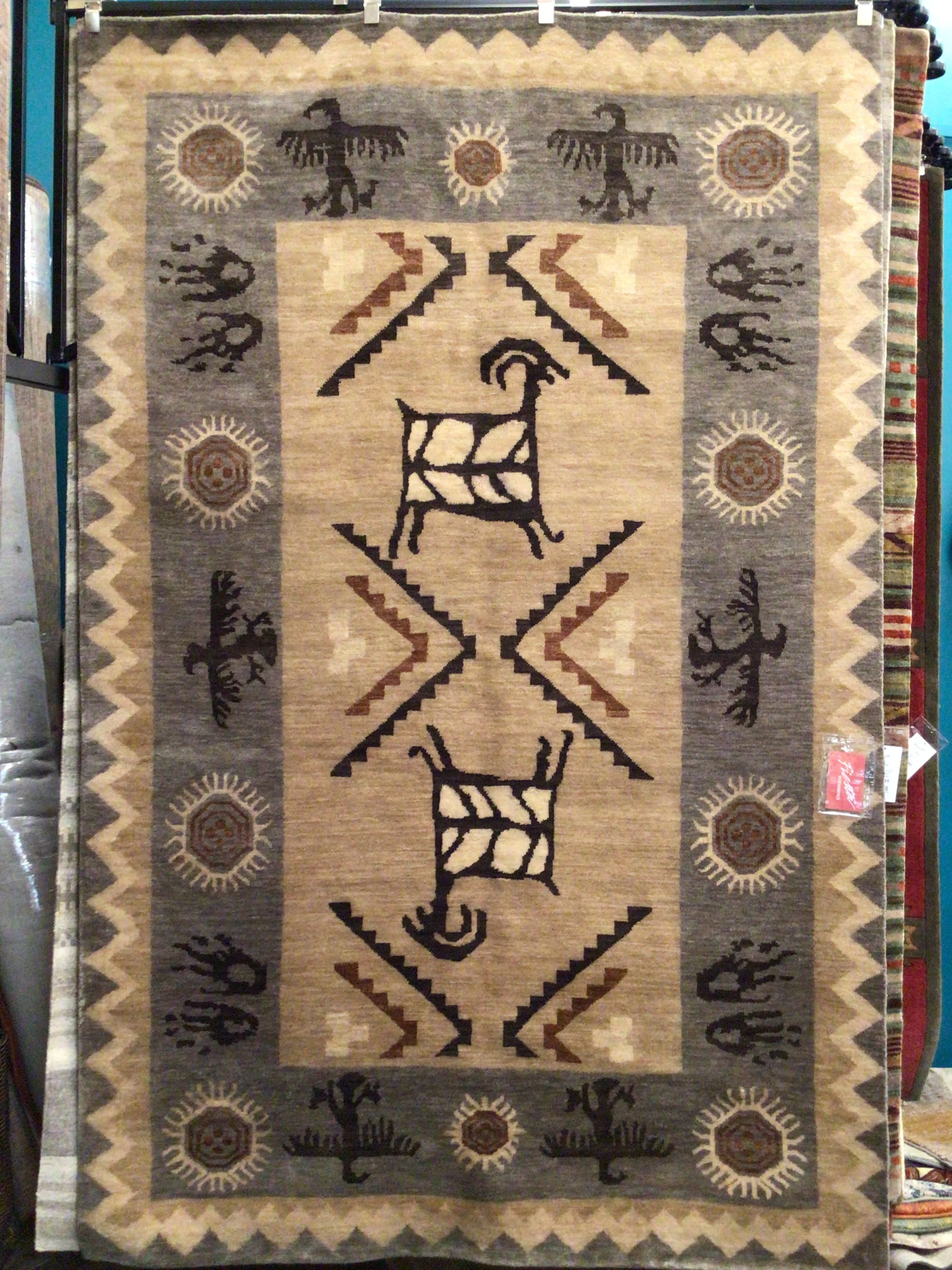 Southwestern Traditional patterned rug with central design and border details