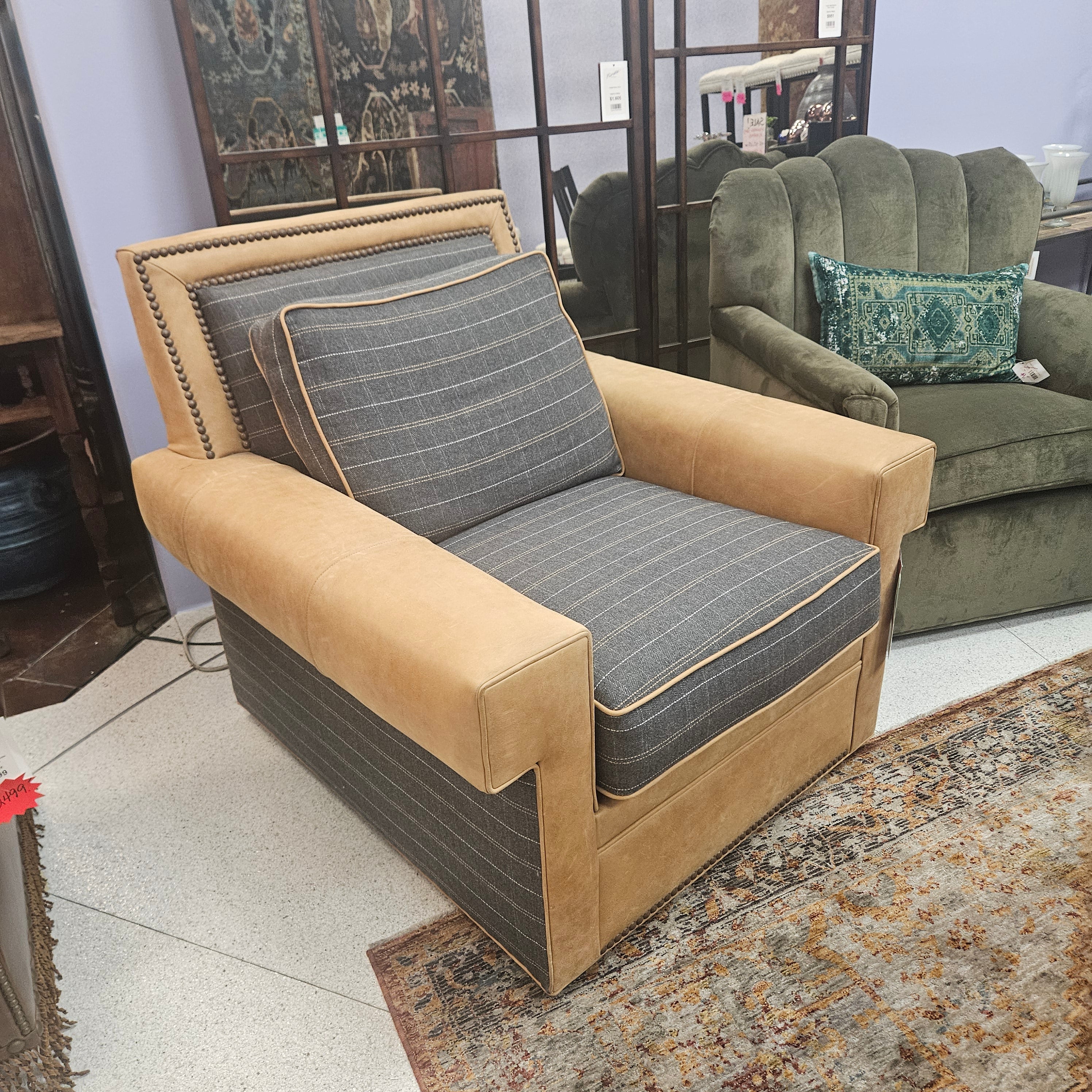Sectional sofa with beige and gray cushions in a room setting.