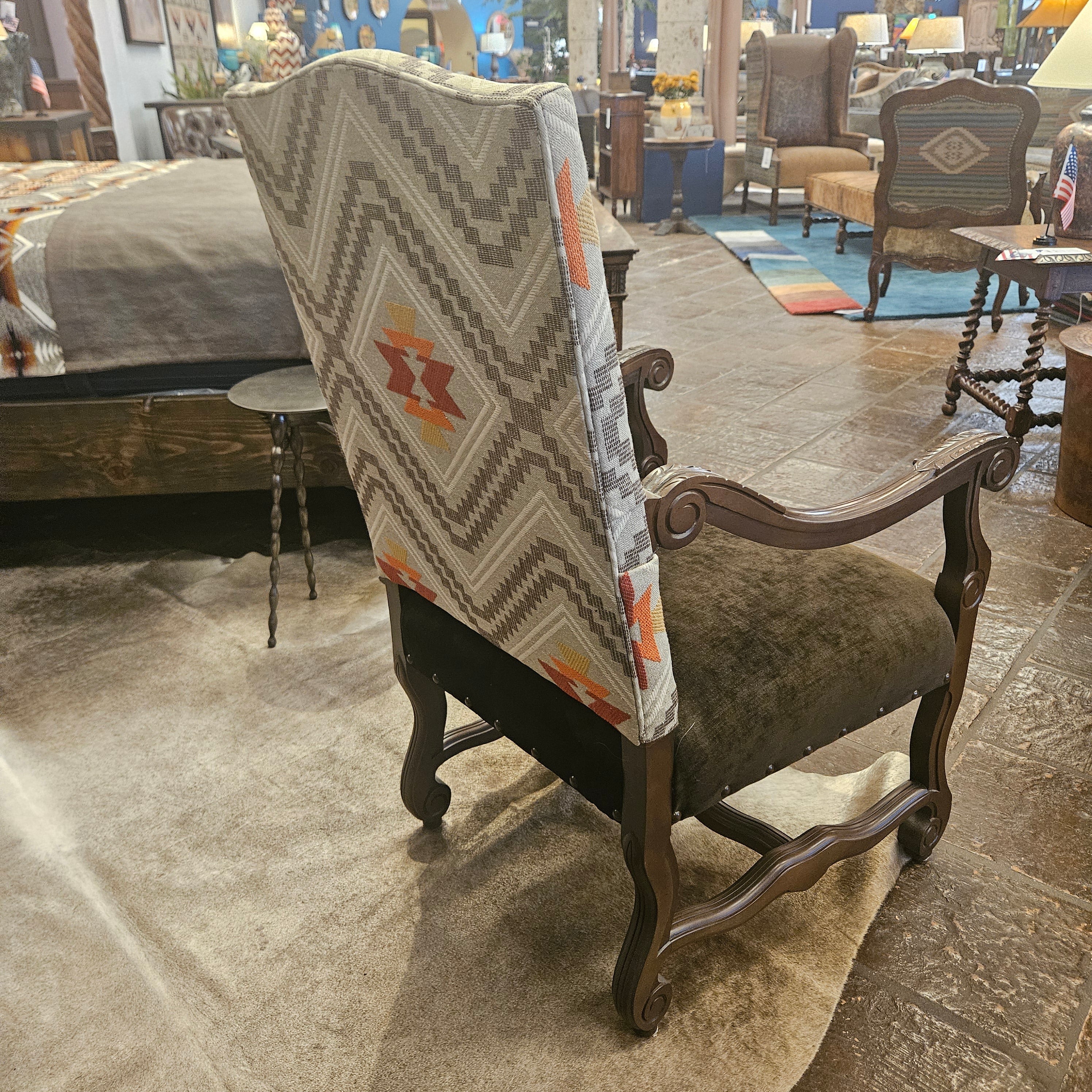 Chair with a patterned cushion on a stone floor