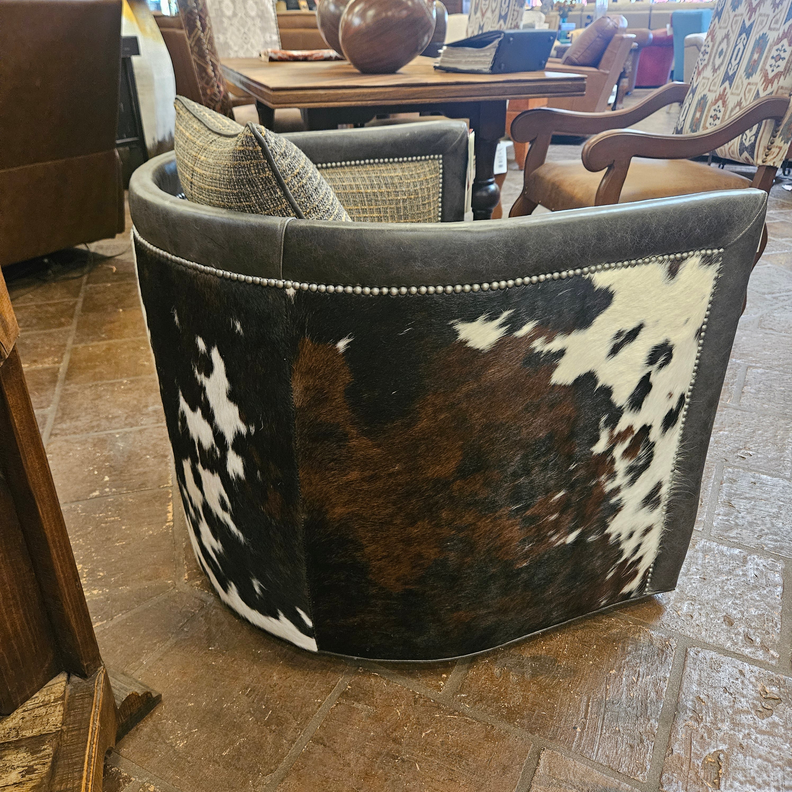 Chair with a cowhide pattern on a stone floor