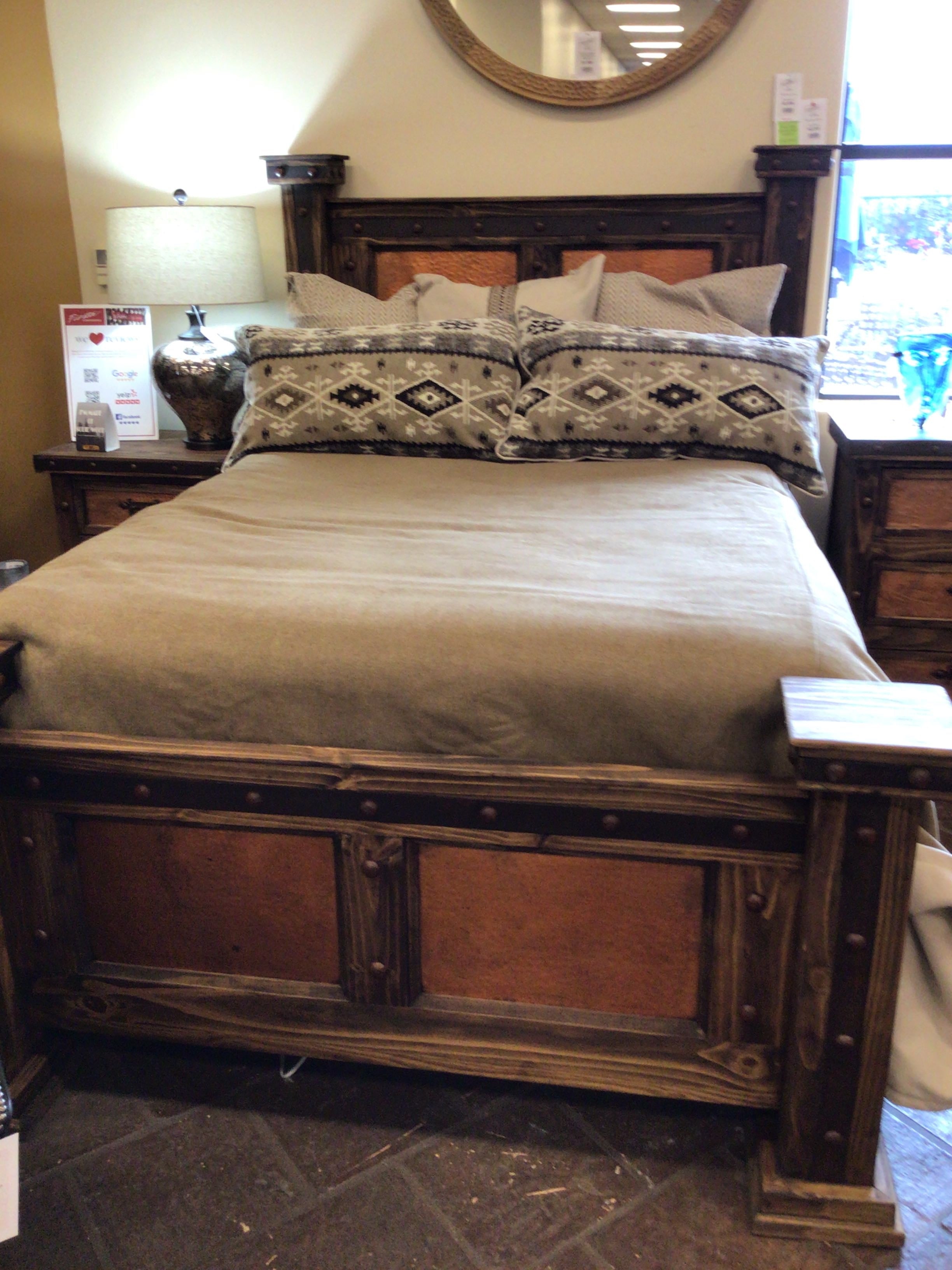 Wooden bed with bedding in a bedroom setting