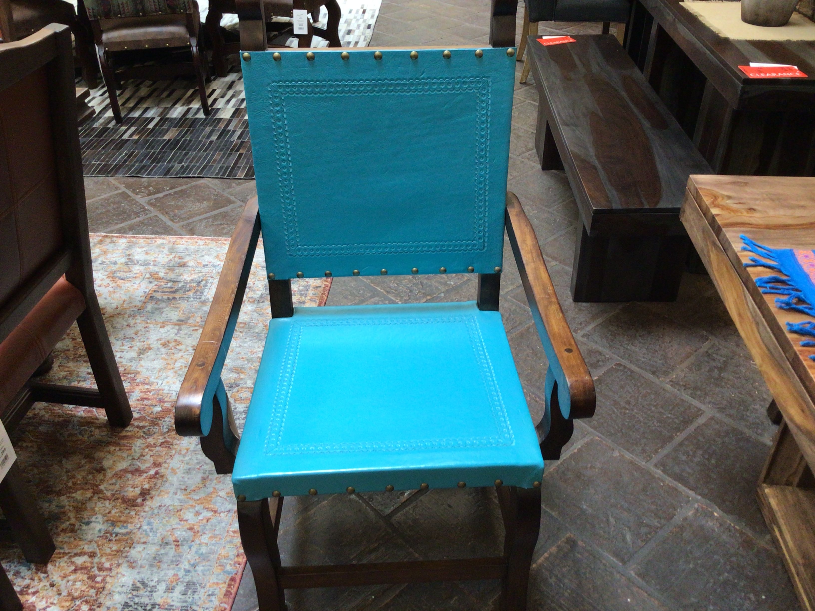 Blue chair with wooden frame on a patterned rug