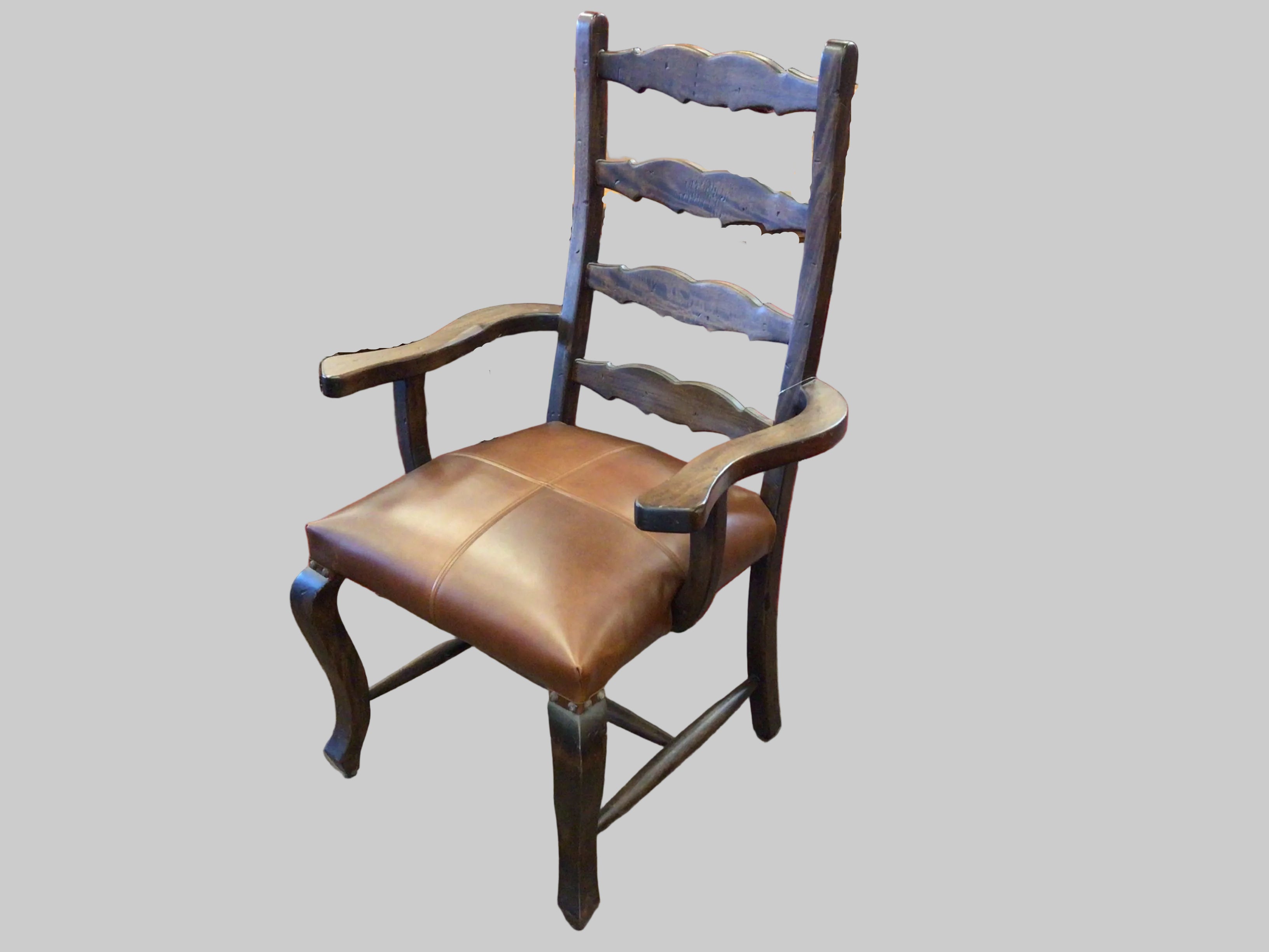 Wooden chair with a brown leather seat on a gray background