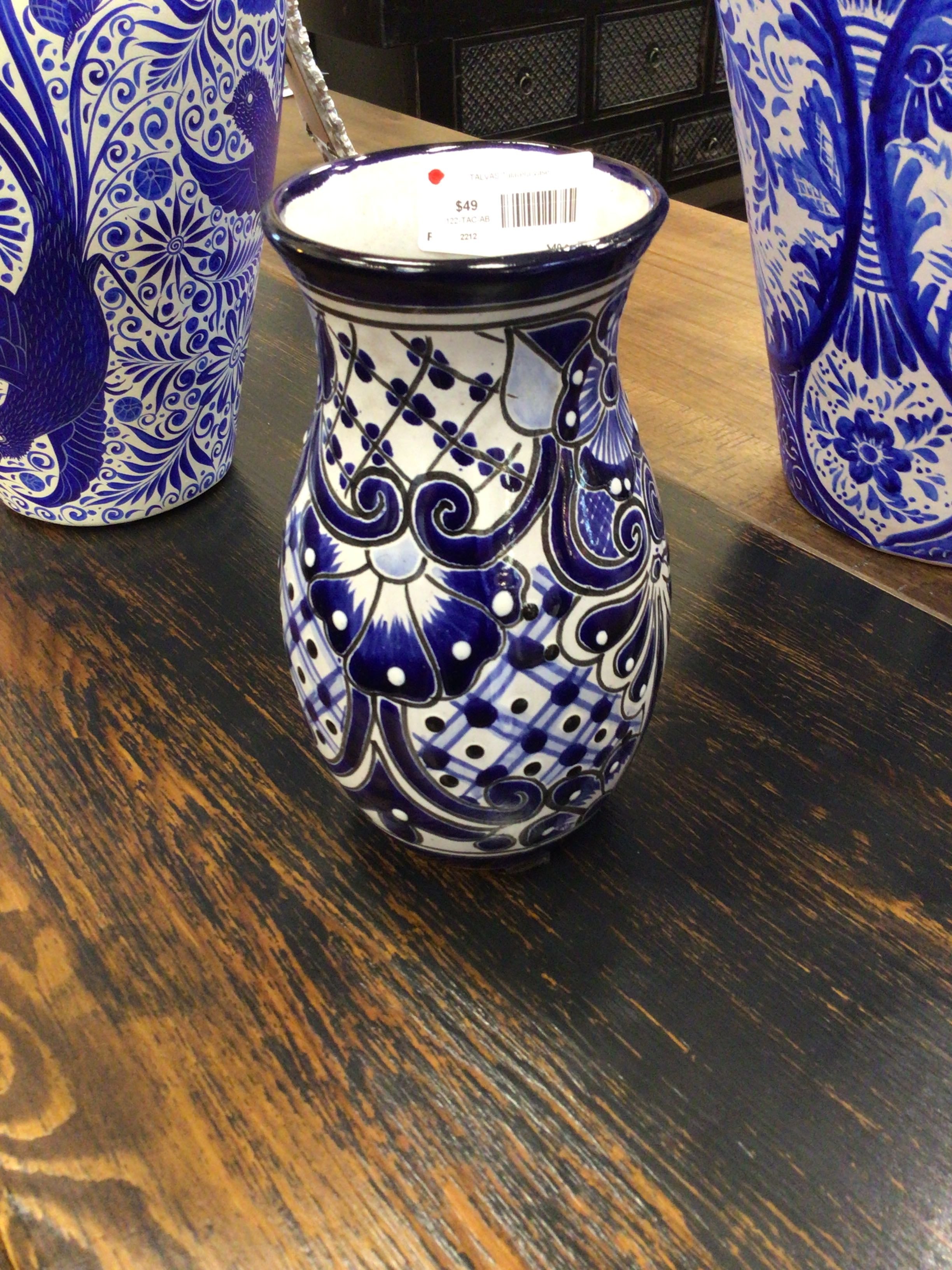 Blue and white patterned vase on a wooden surface