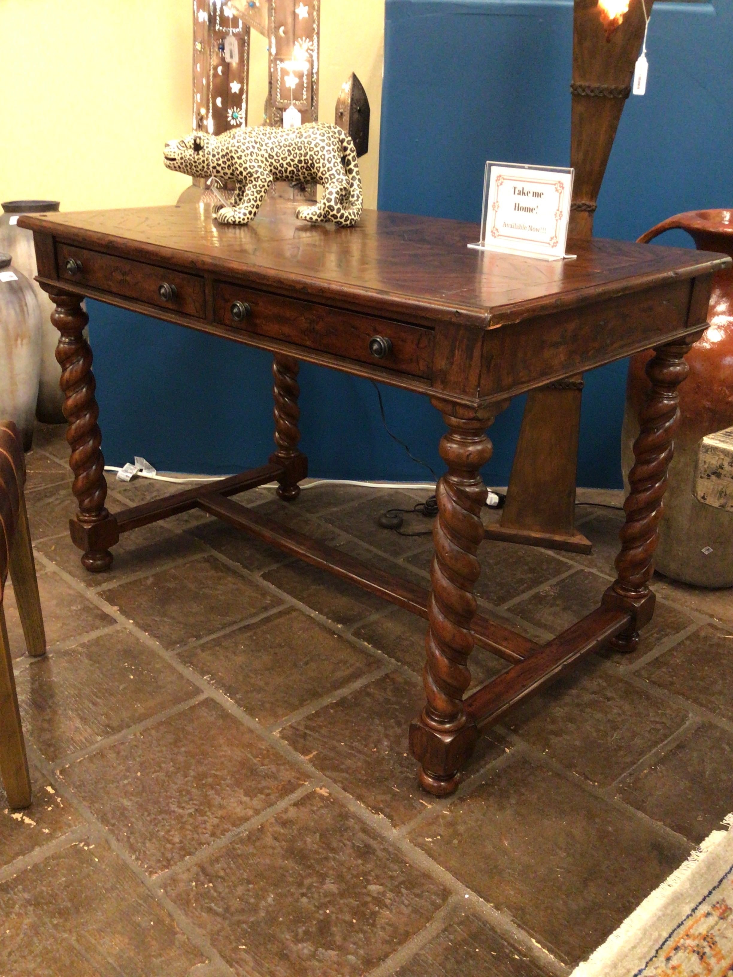 Wooden table with decorative elements on a tiled floor