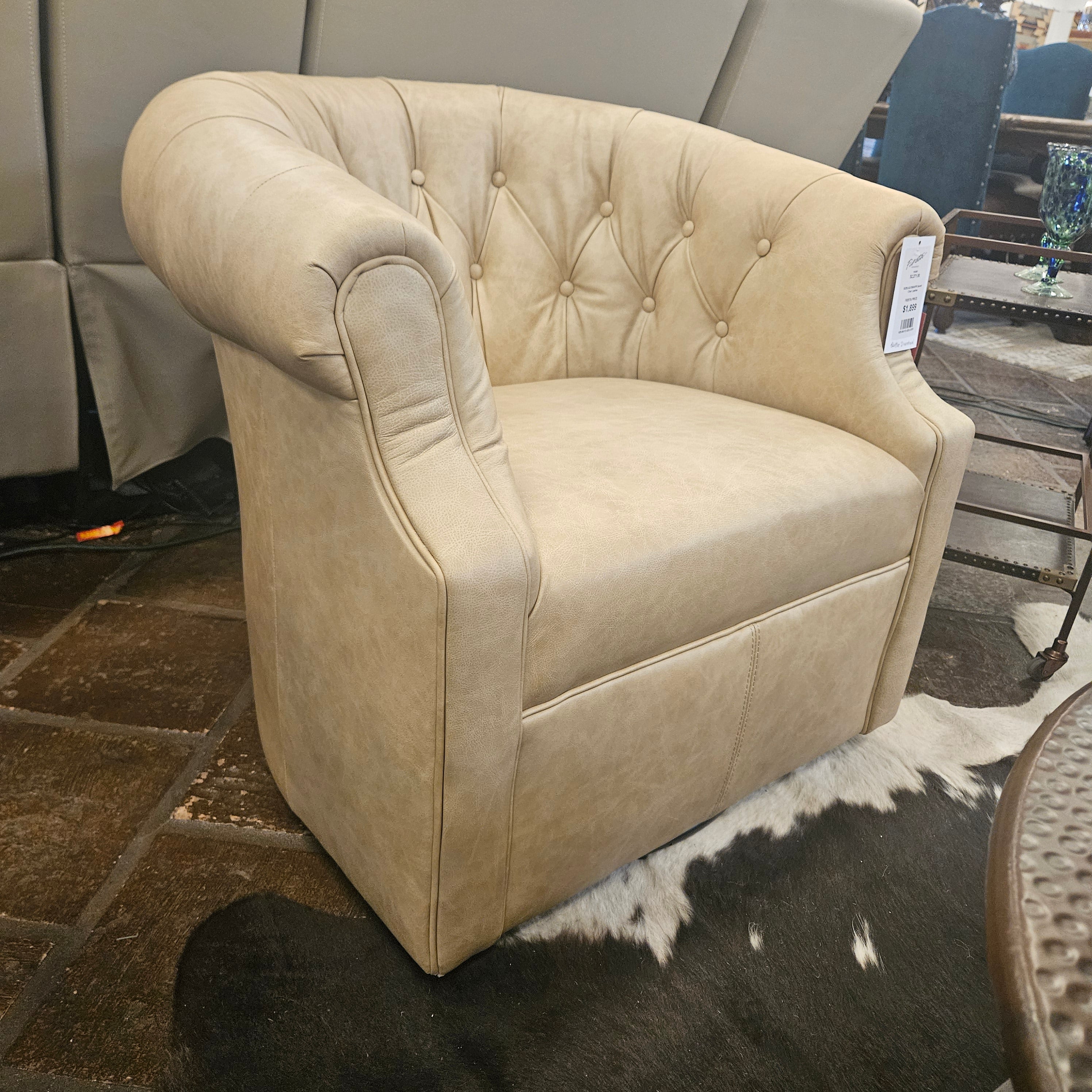 Beige upholstered chair with tufted backrest in a store setting