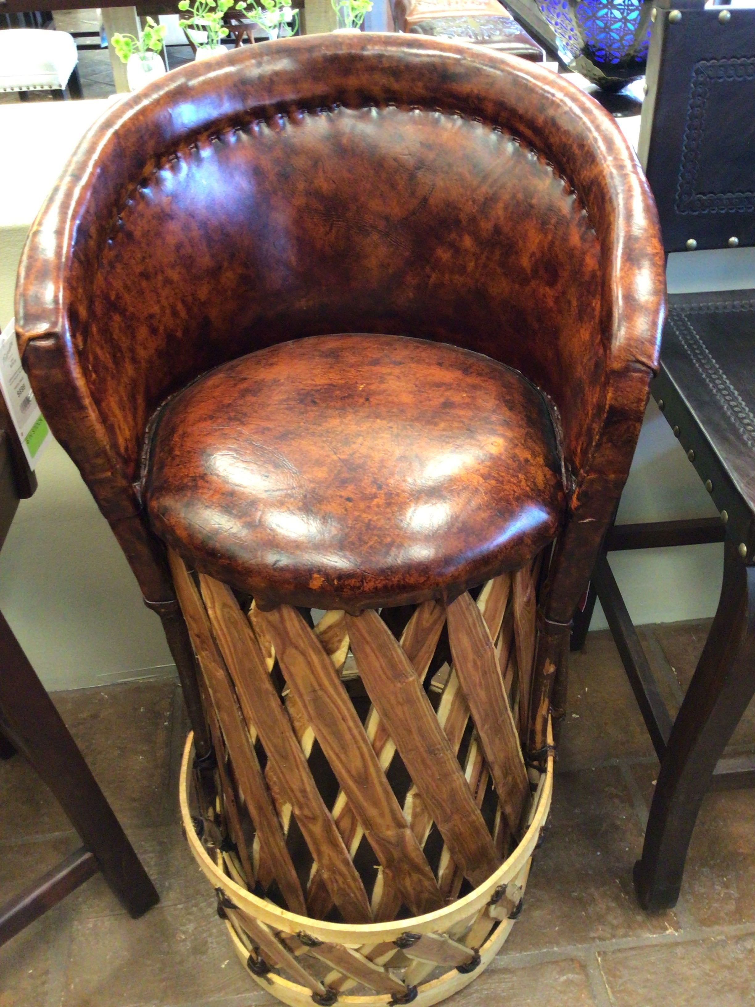 Wooden bar stool with wicker base in a casual setting
