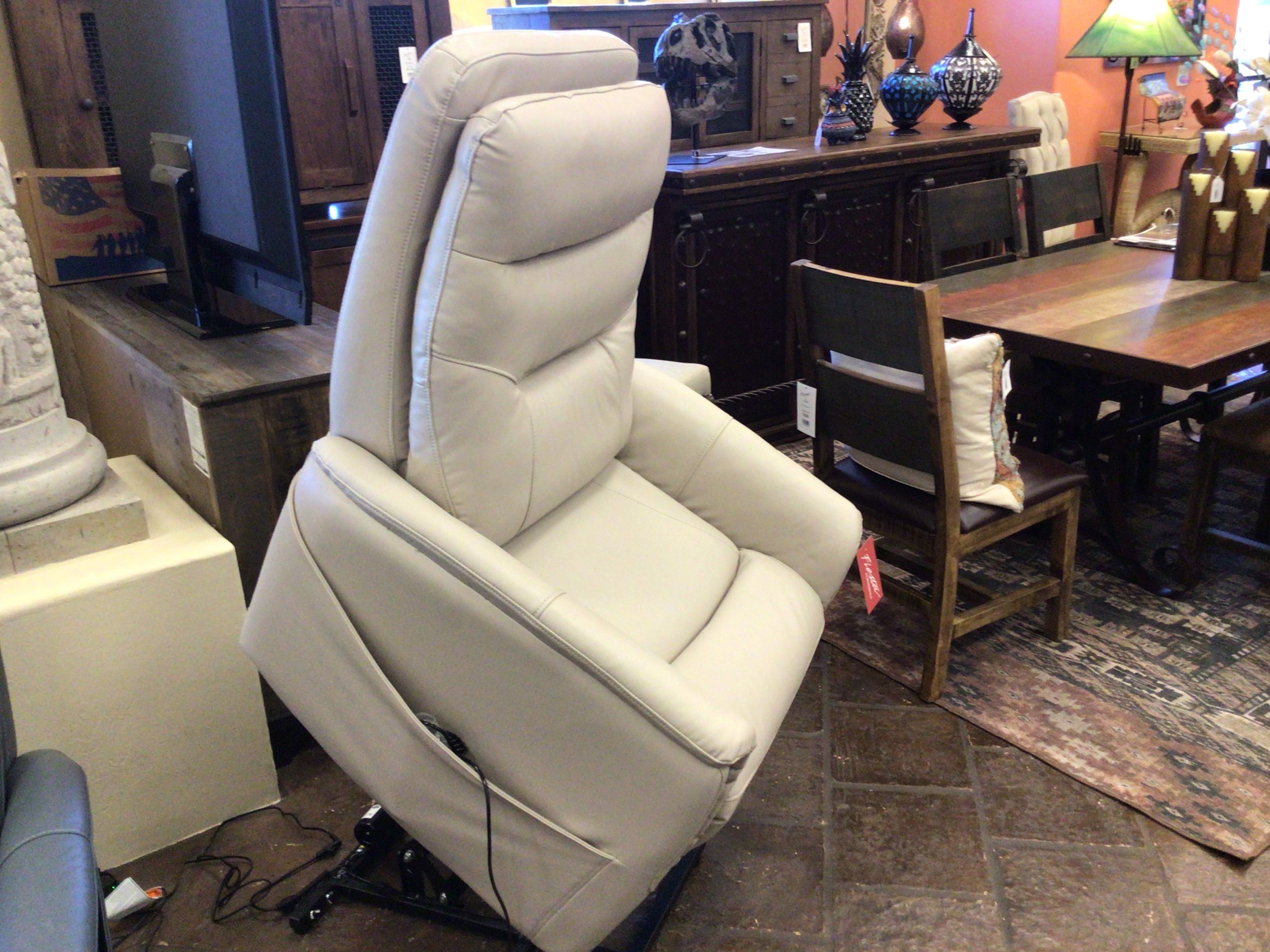 Beige recliner chair in a room with furniture and decor