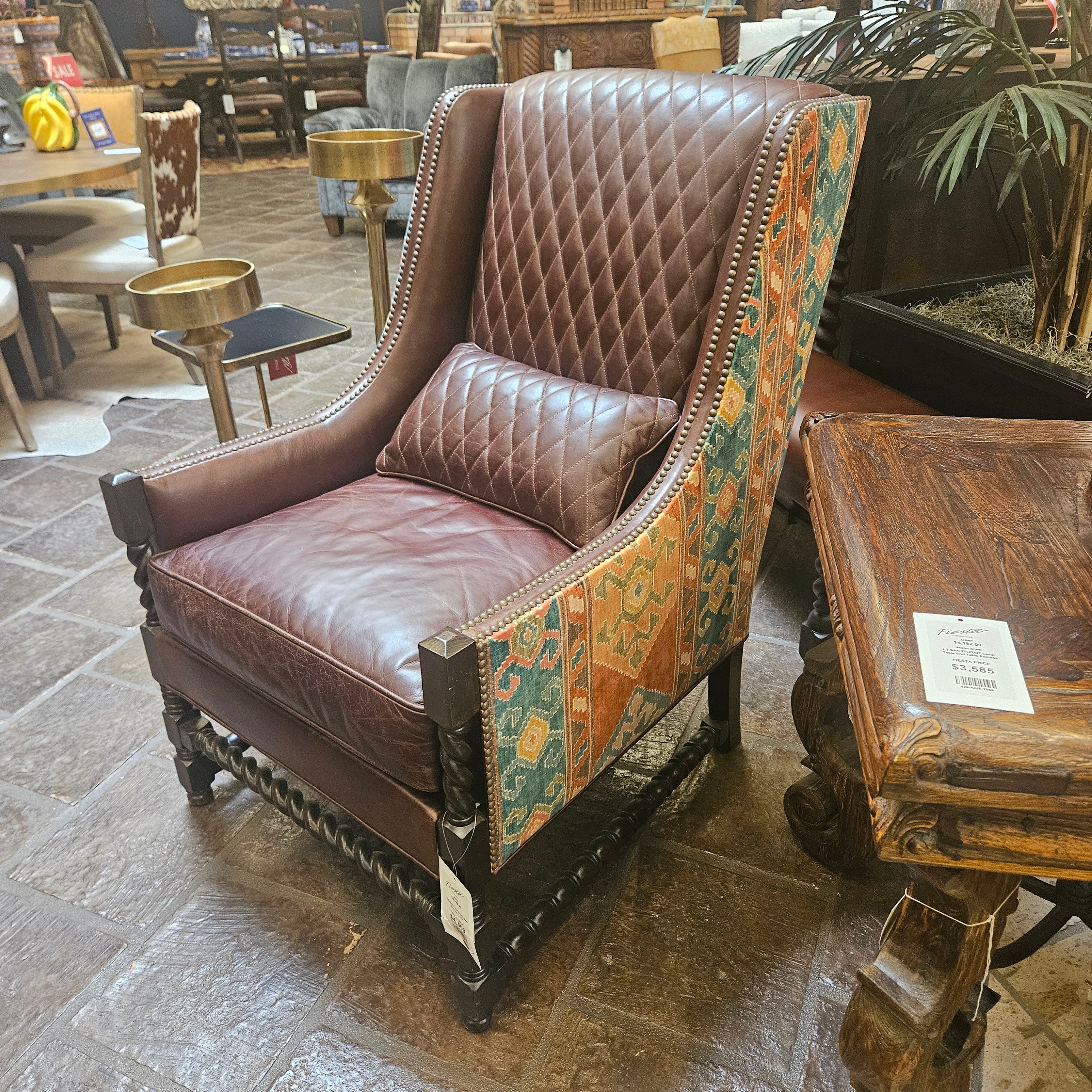 Decorative armchair with quilted backrest in a showroom setting