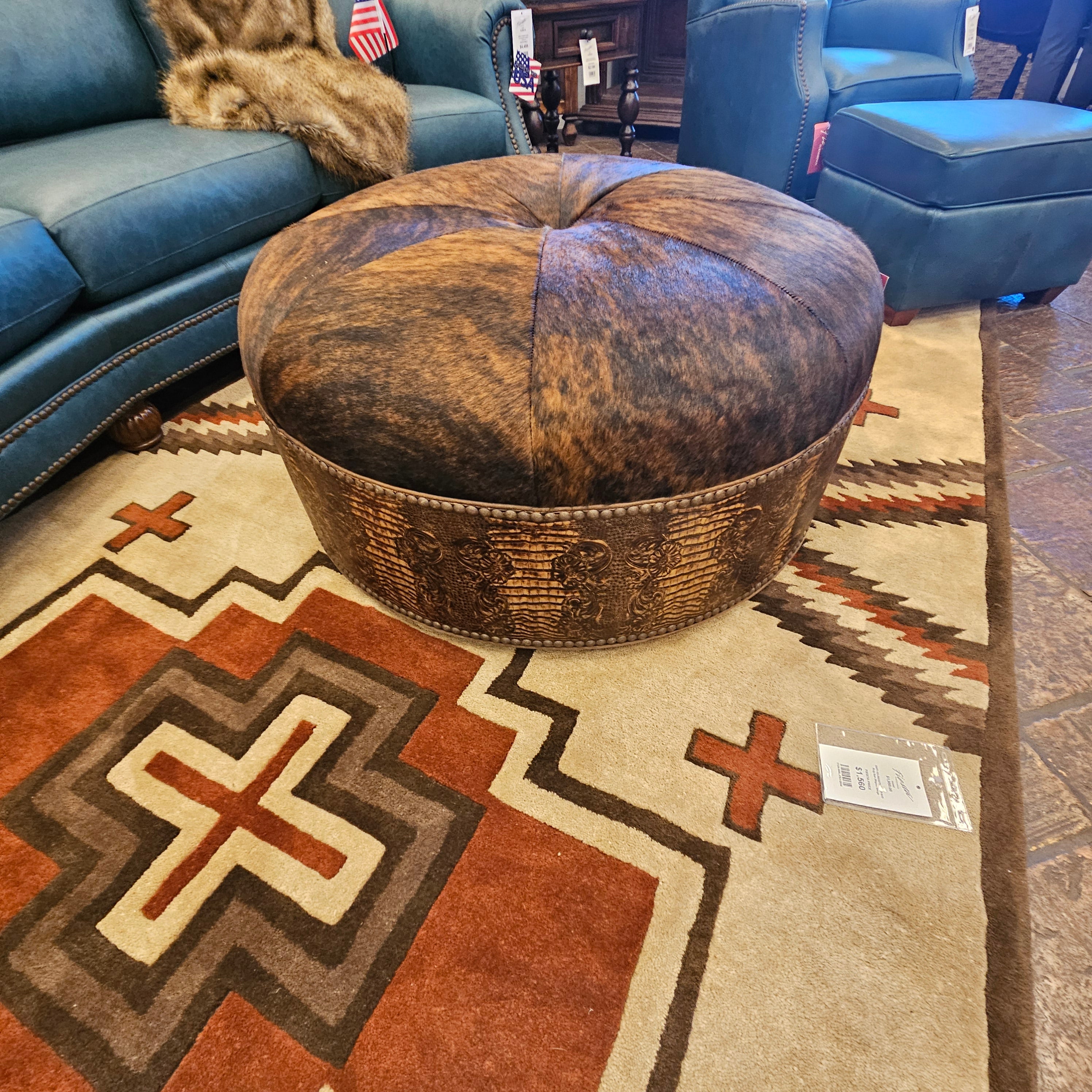 Wooden bowl on a patterned rug with a blue chair and American flag in the background