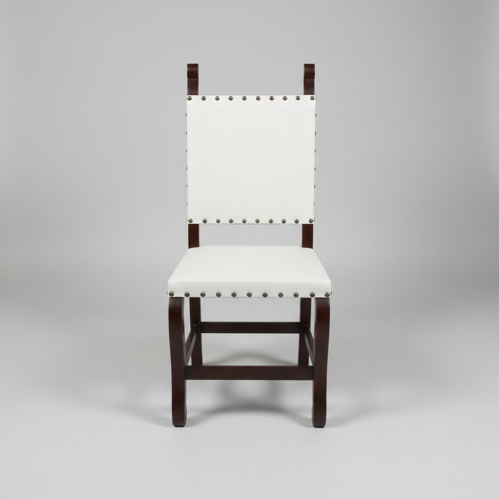 White chair with black legs on a stone floor in an indoor setting