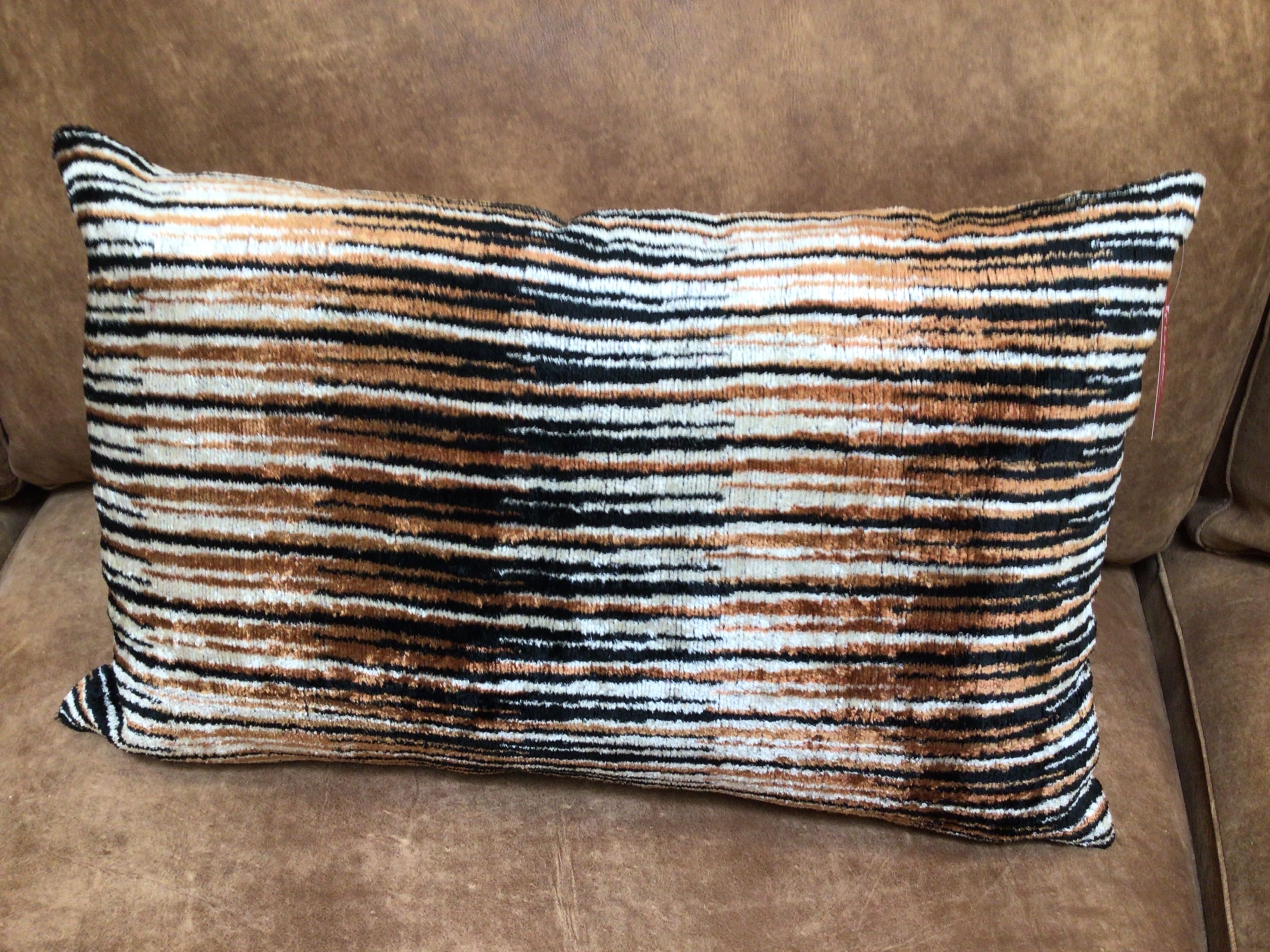 Striped pillow on a brown sofa