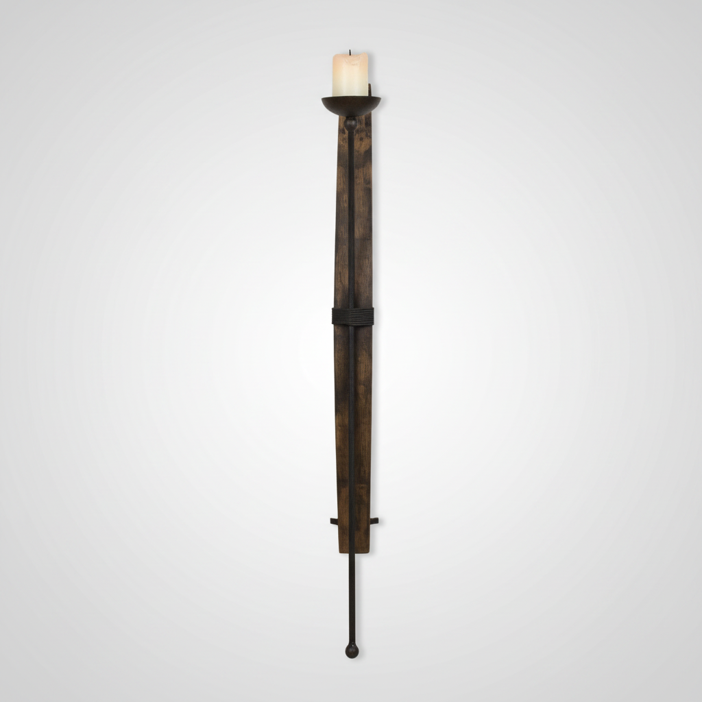 A rustic wall-mounted candle holder designed like a sword hilt, featuring a dark brown wood-grain textured body, black metal accents, and a lit white pillar candle at the top, shown against a light gray gradient background.
