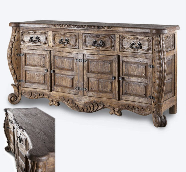 Wooden dresser with intricate carvings on a white background