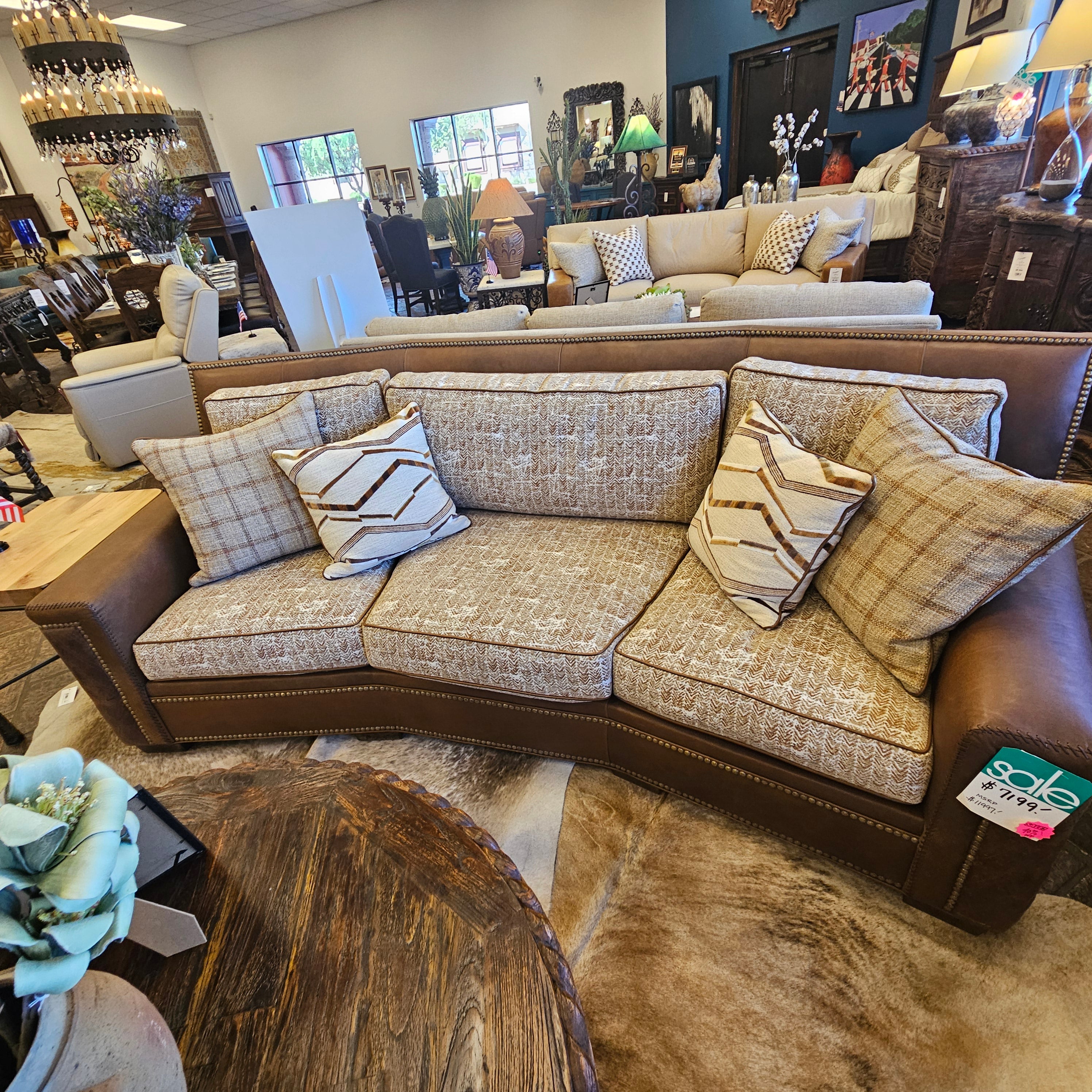 Sectional sofa with patterned cushions in a furniture store setting