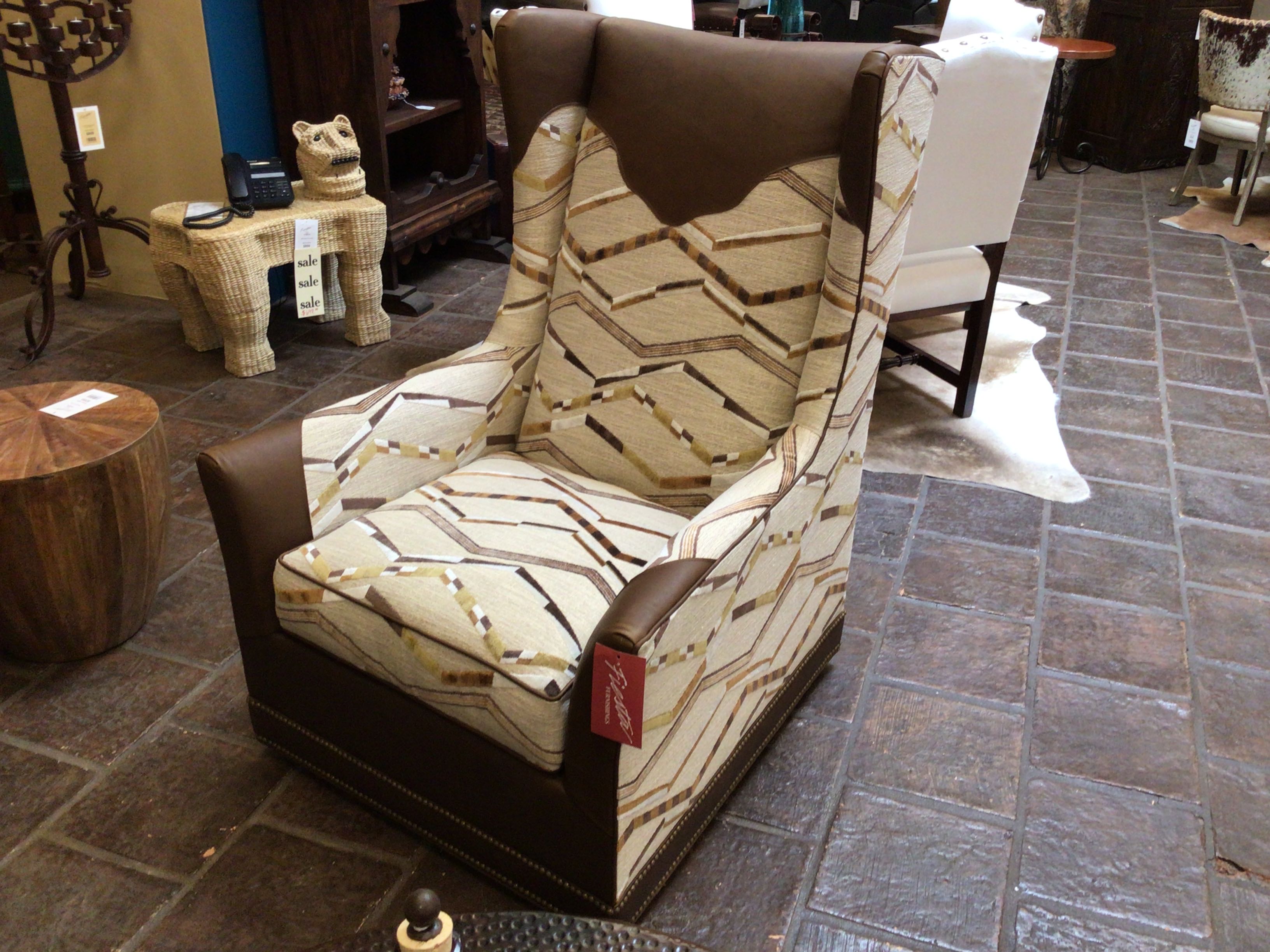 Patterned armchair in a room with furniture and decor